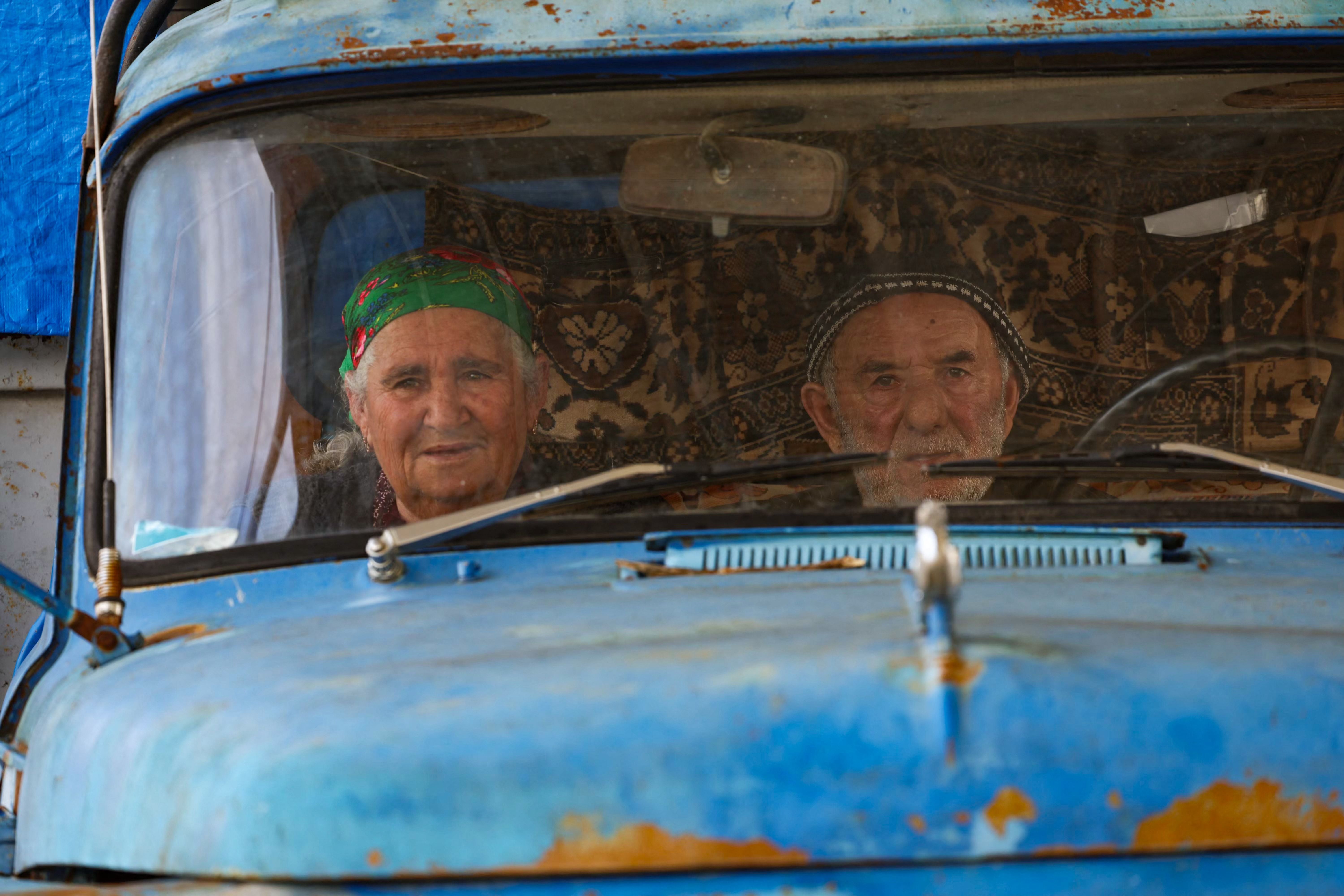 Refugees wait to cross the border, leaving Karabakh for Armenia, at Lachin on Tuesday