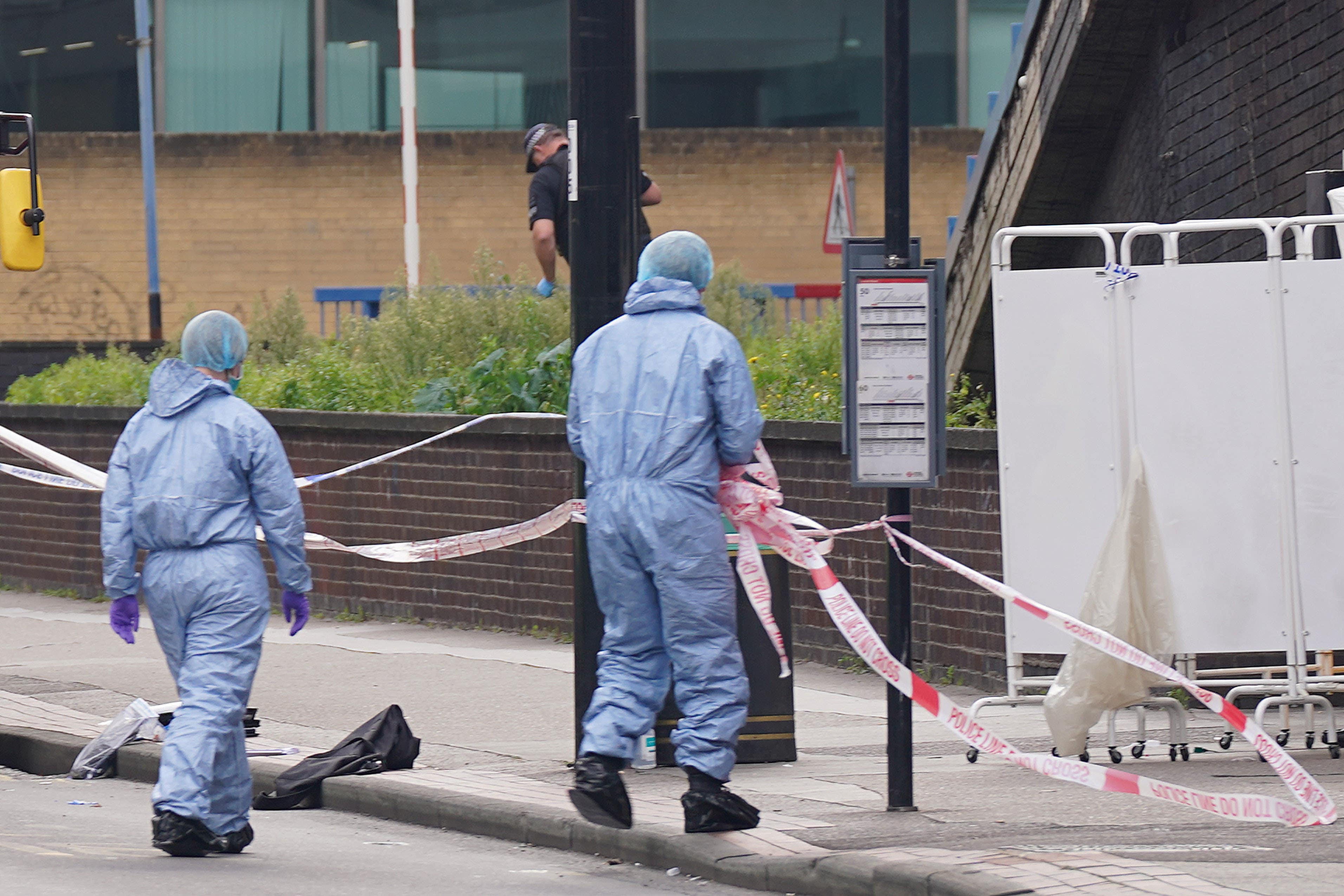 Police and forensic investigators at the scene