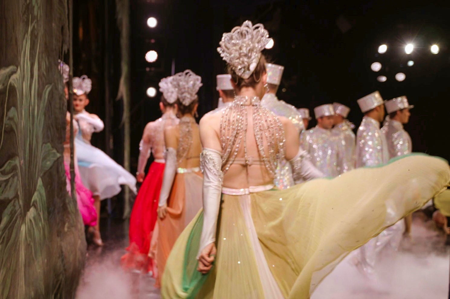 Topless dancers heading to the Moulin Rouge stage