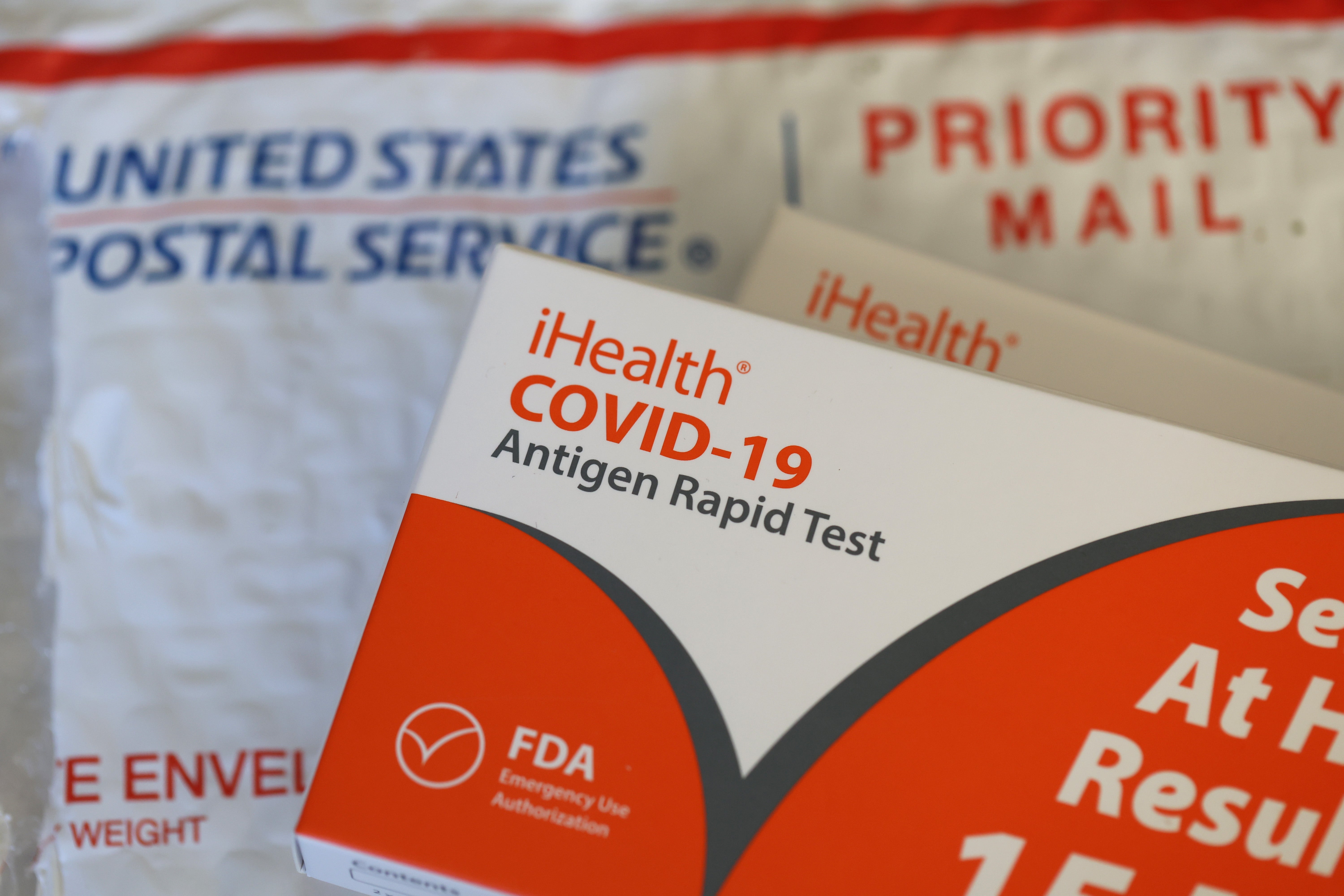 n this photo illustration, free iHealth COVID-19 antigen rapid tests from the federal government sit on a U.S. Postal Service envelope after being delivered on February 04, 2022 in San Anselmo, California.