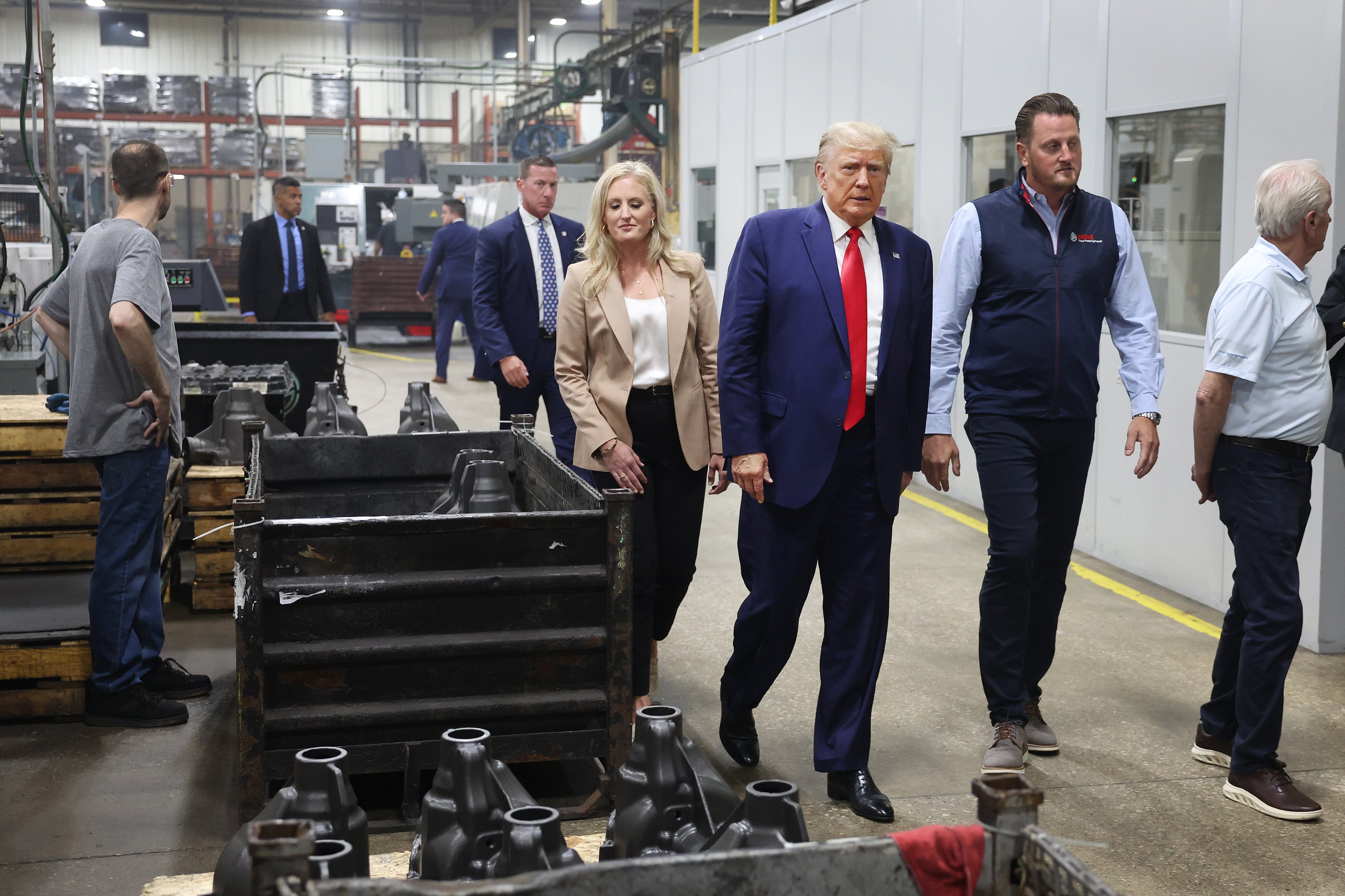 Republican presidential candidate former President Donald Trump tours Drake Enterprises, an automotive parts manufacturer, before speaking to guest at a small rally on September 27, 2023 in Clinton Township, Michigan.