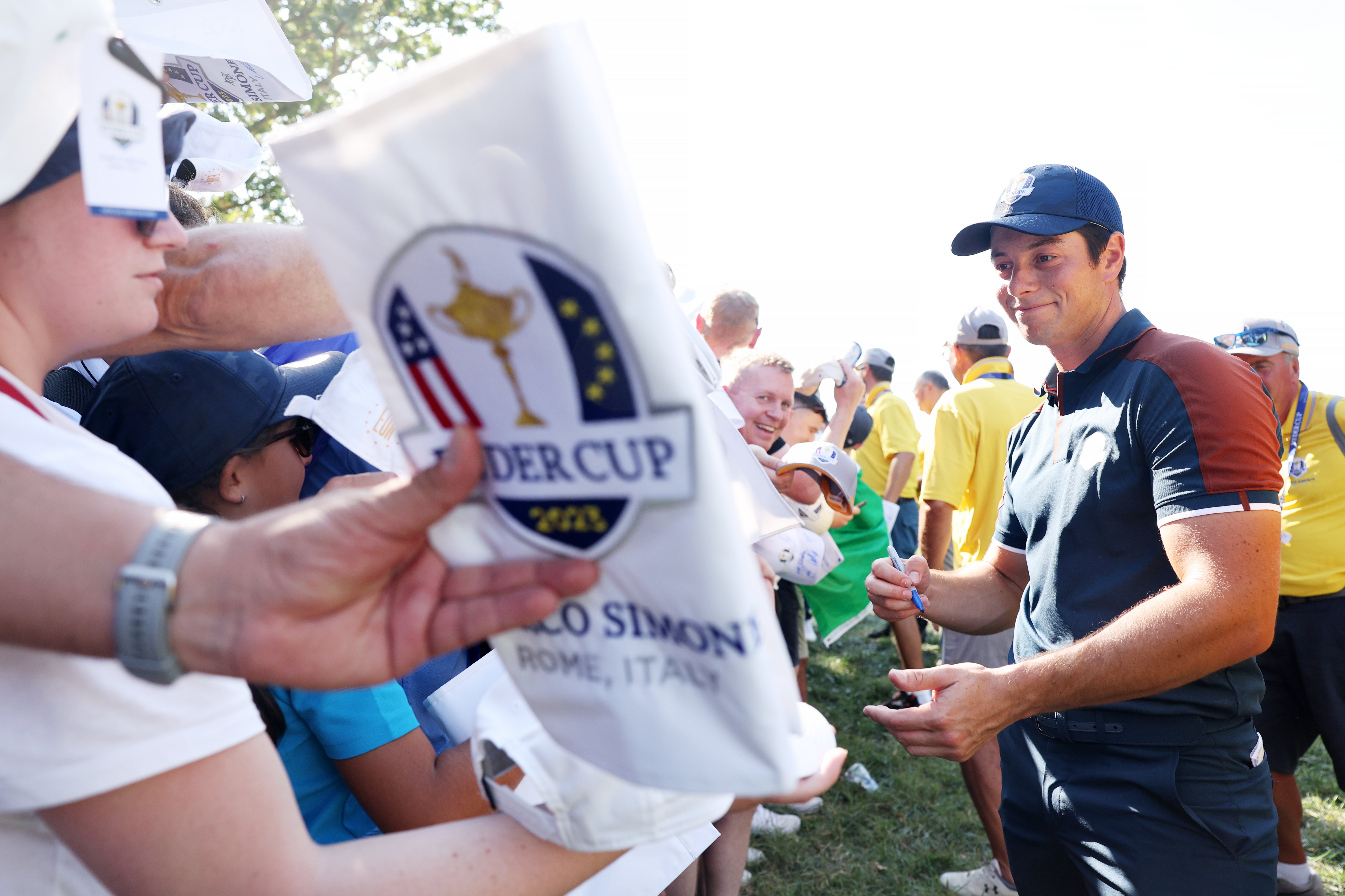 Viktor Hovland signs memorabilia for fans during Thursday’s final practice round