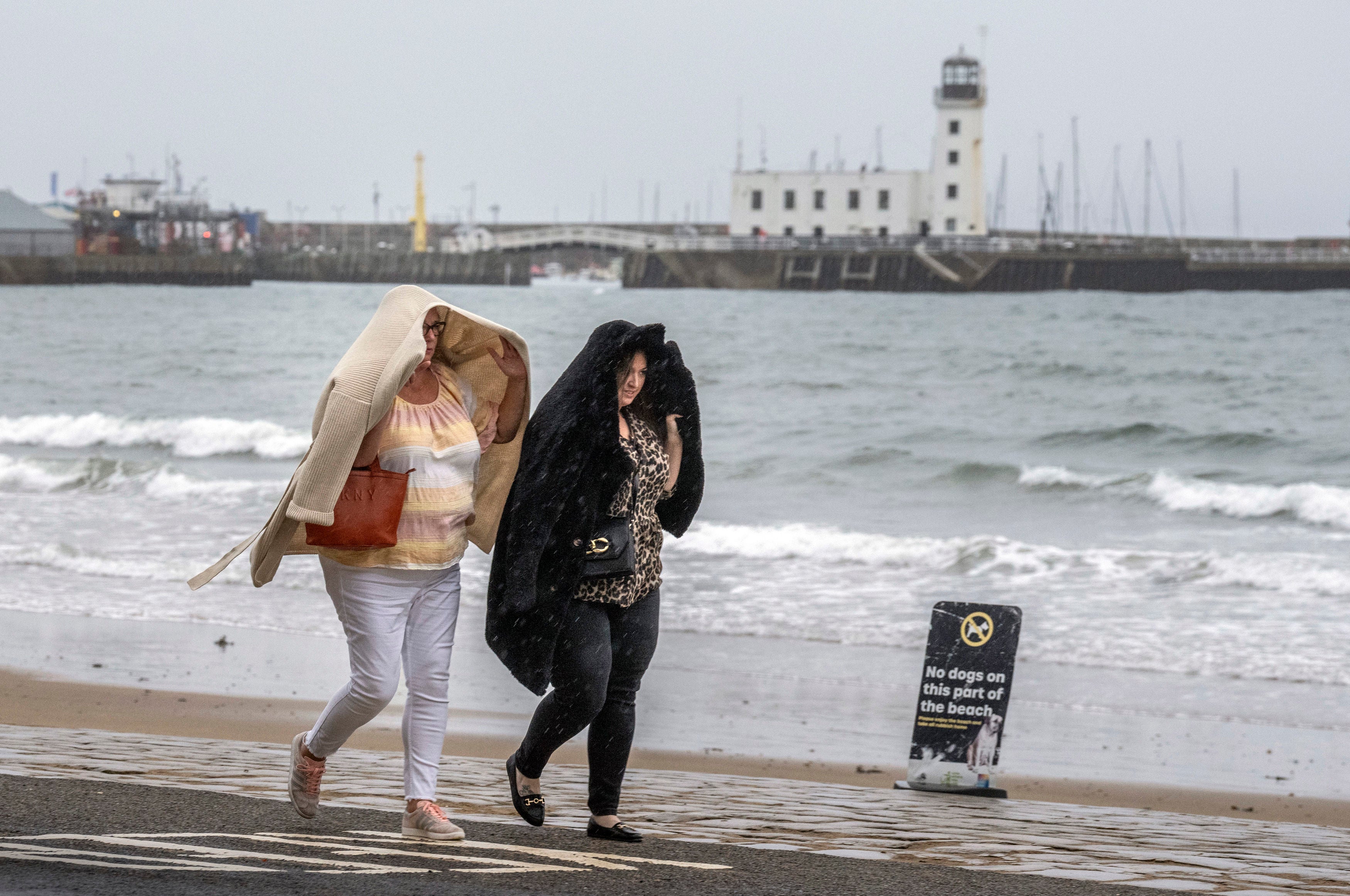 People walk along the sea front in Scarborough, North Yorkshire