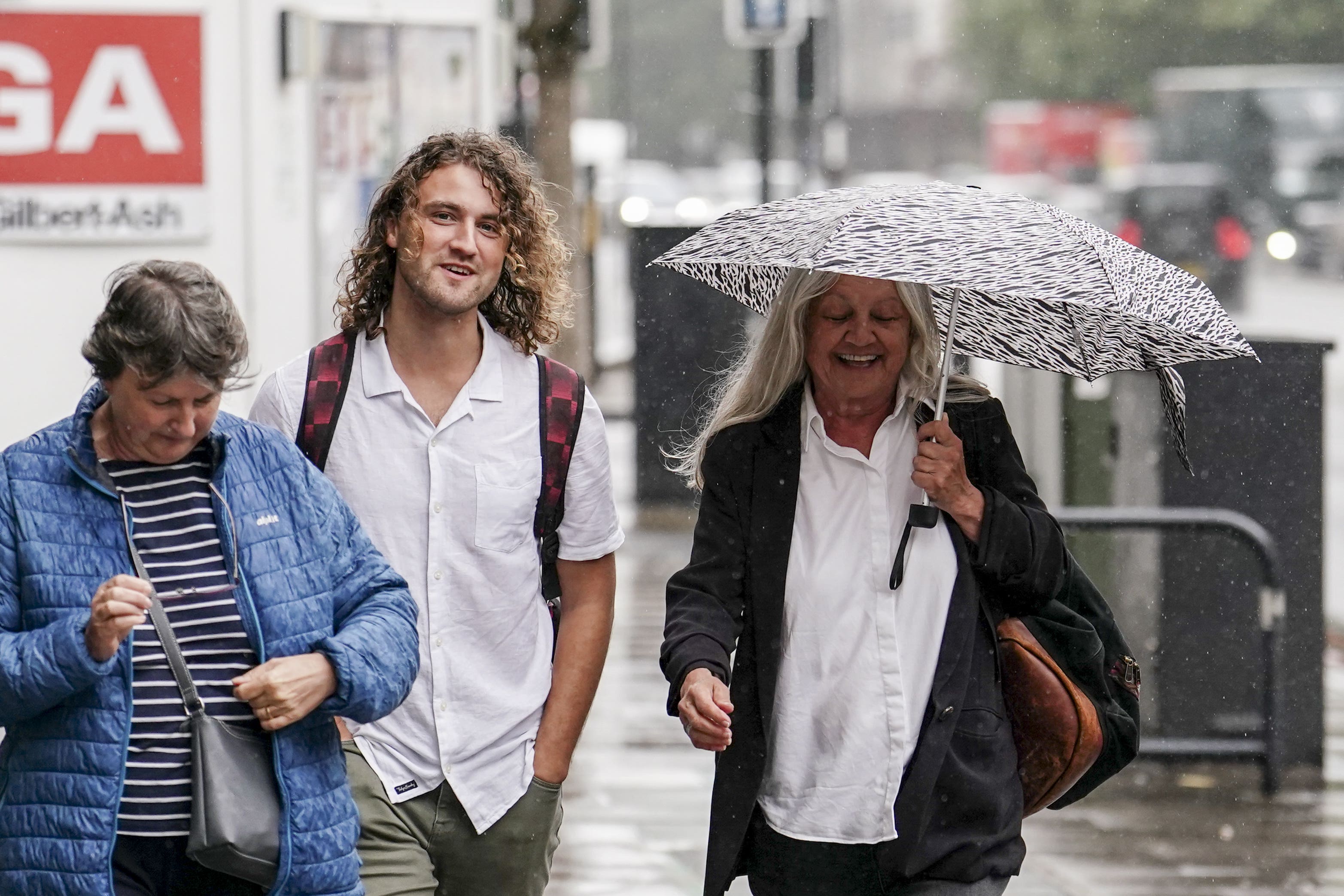 Climate protesters Jacob Bourne, centre), and Judit Murray, right (PA)