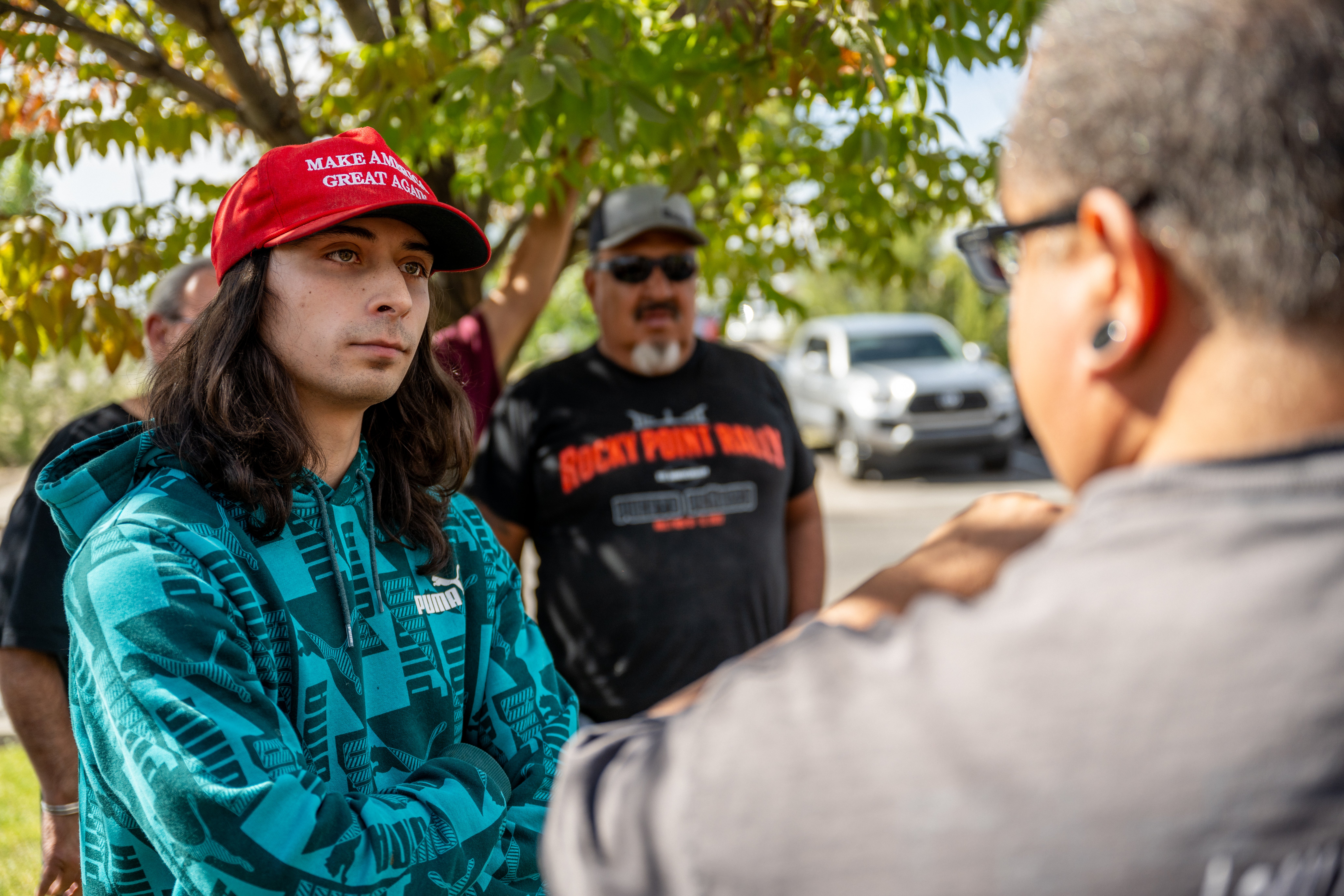 A counter demonstrator listens to an attendee during a protest against the reinstallation of a 16th-century New Mexico conquistador statue at the Rio Arriba County building on September 28, 2023 in Espanola, New Mexico