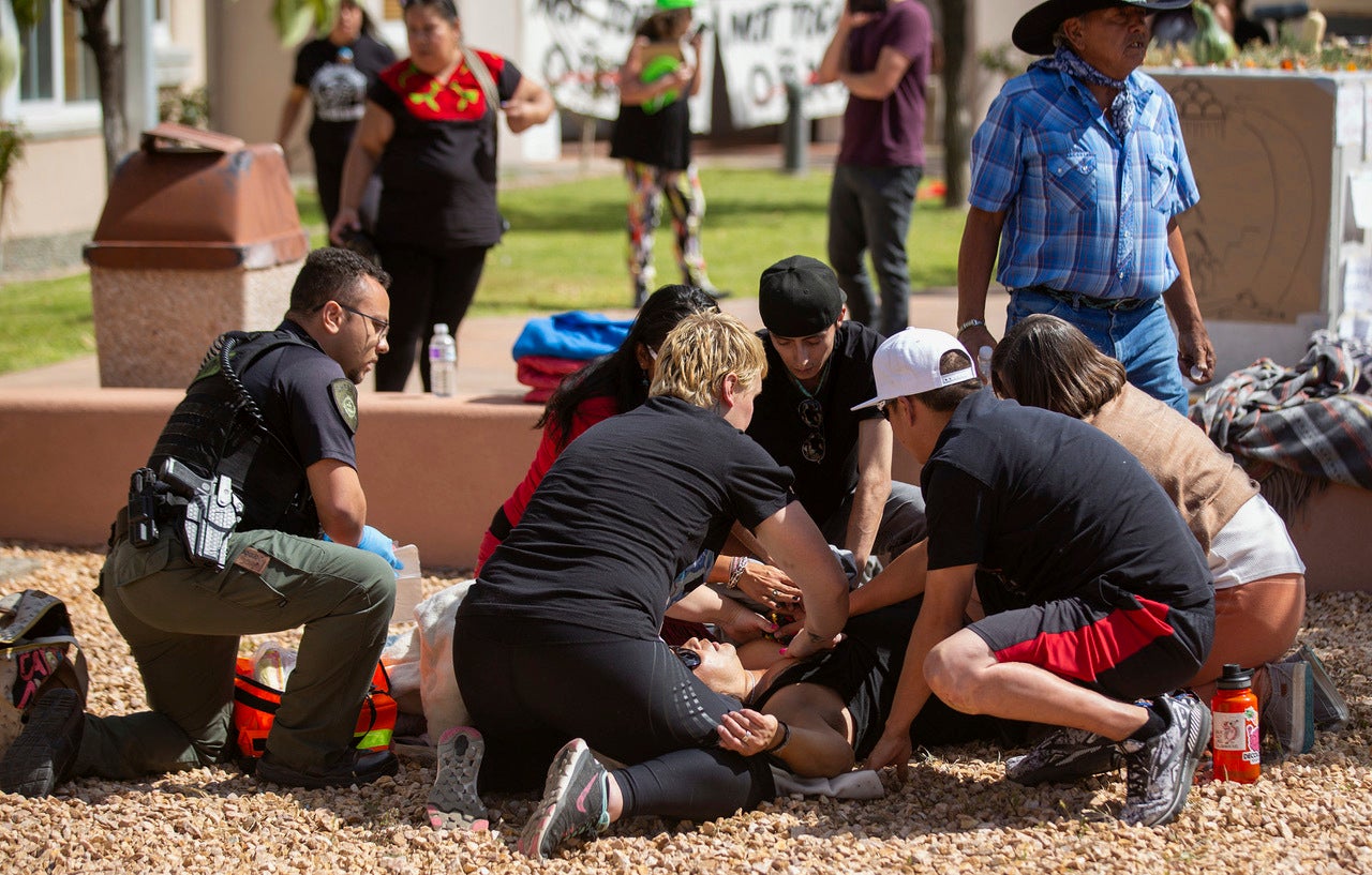 Medical personnel attend to Mr Johns following the shooting in Española