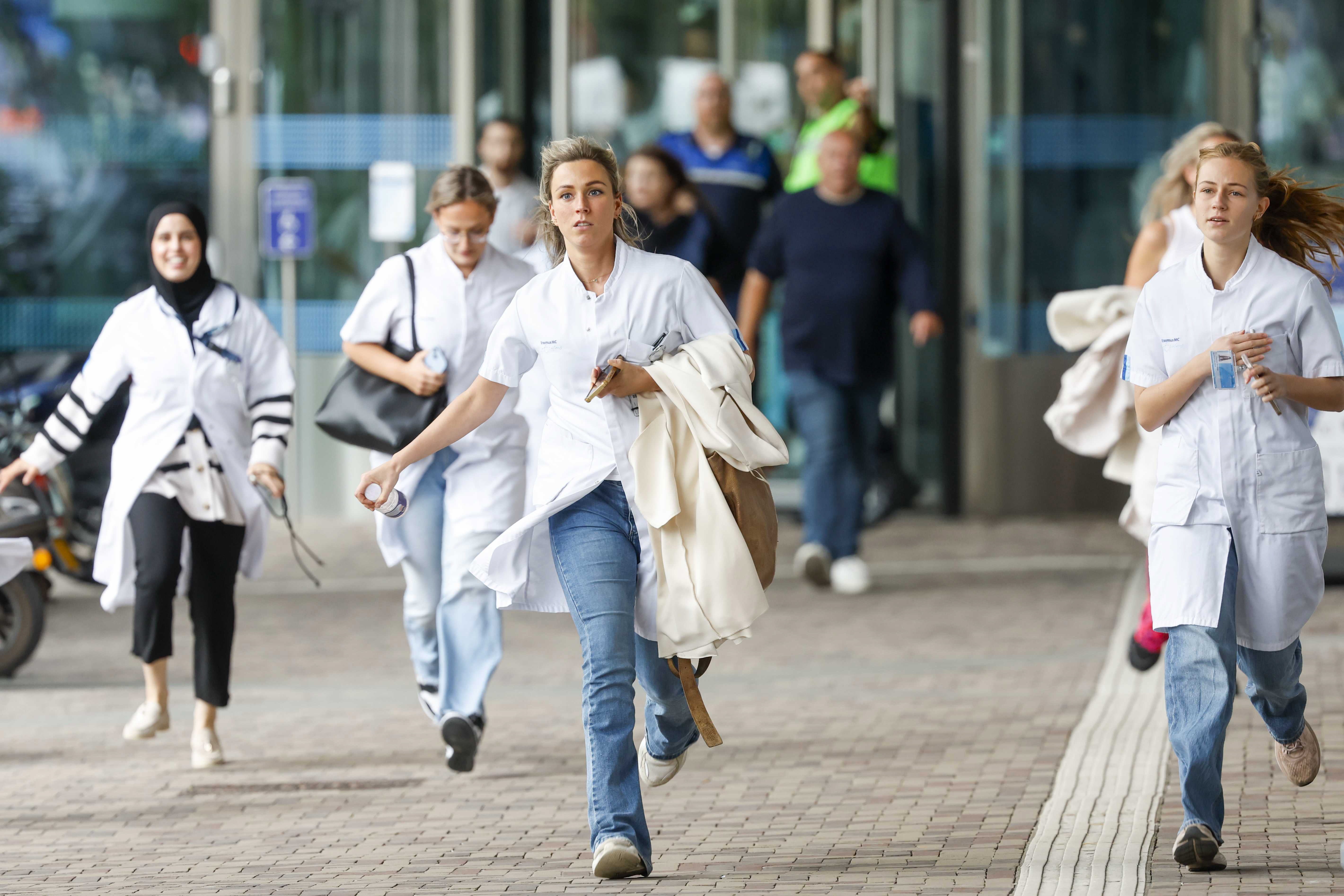 Medical staff flee the Erasmus University Medical Center in Rotterdam after a lecturer was shot