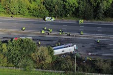 Girl, 15, and driver killed in M53 crash after school bus overturns