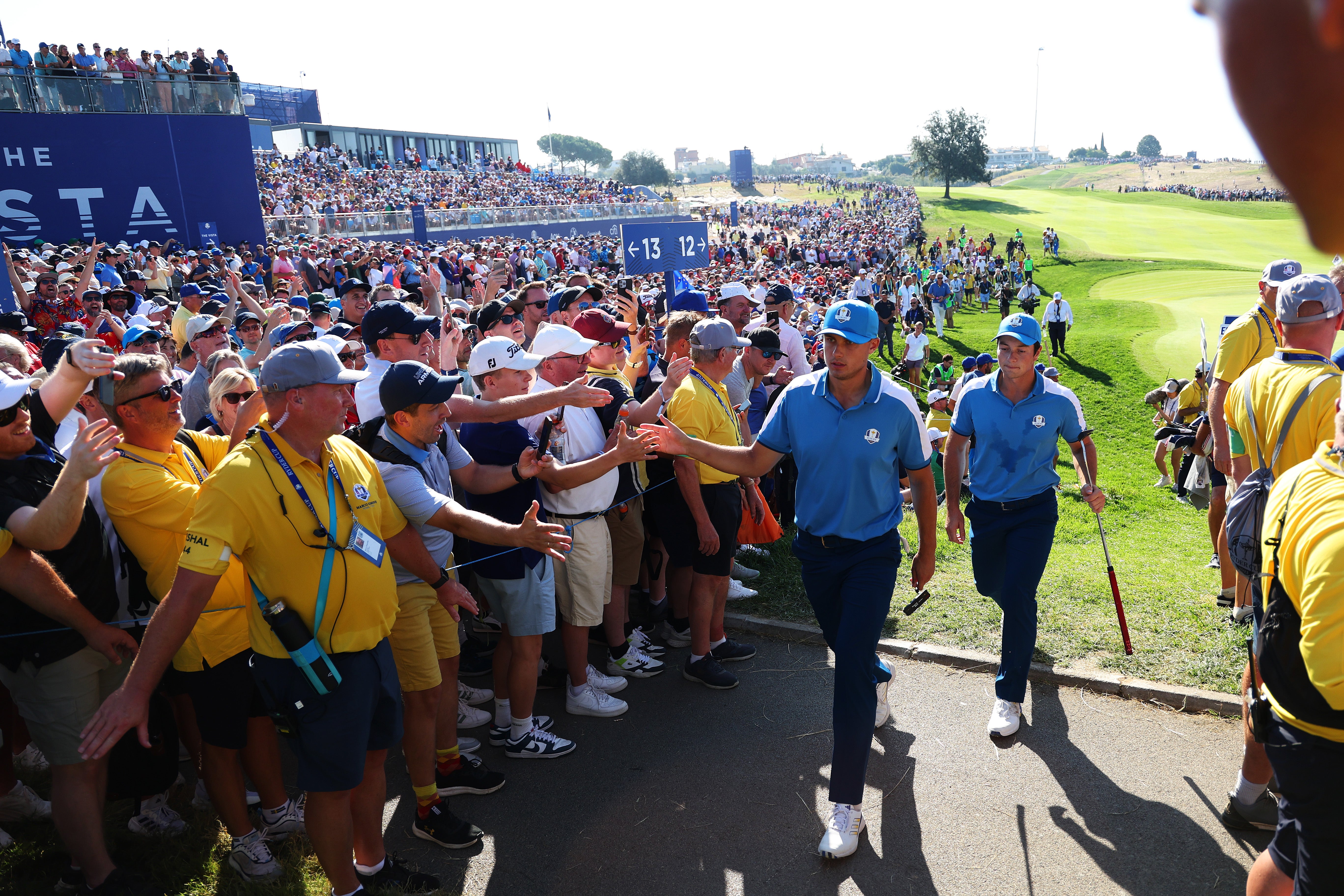 Aberg and Hovland walk to the 13th tee