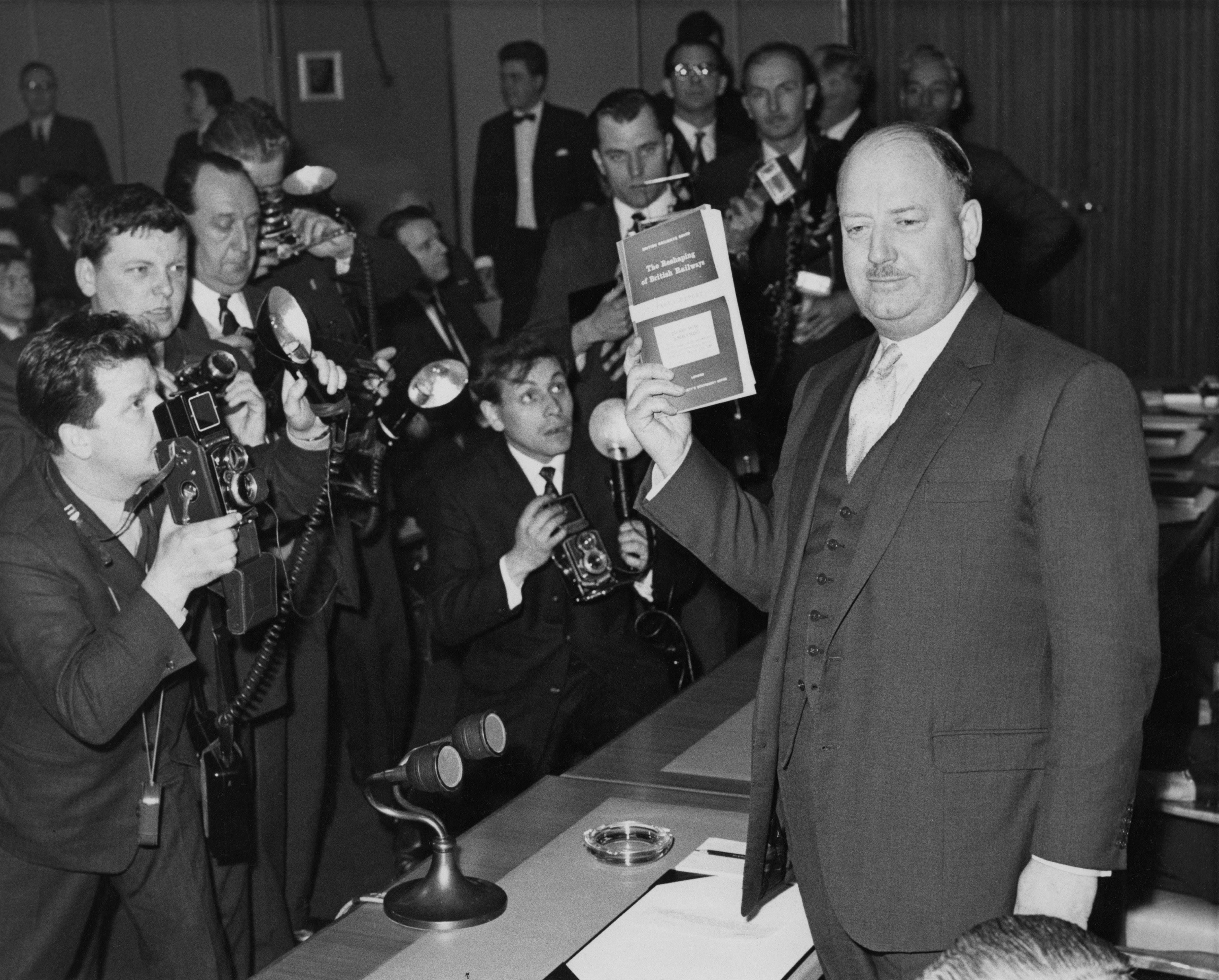 Richard Beeching, chair of the British Transport Commission, holds a press conference in London to announce his proposed restructuring of Britain’s railways, 1963