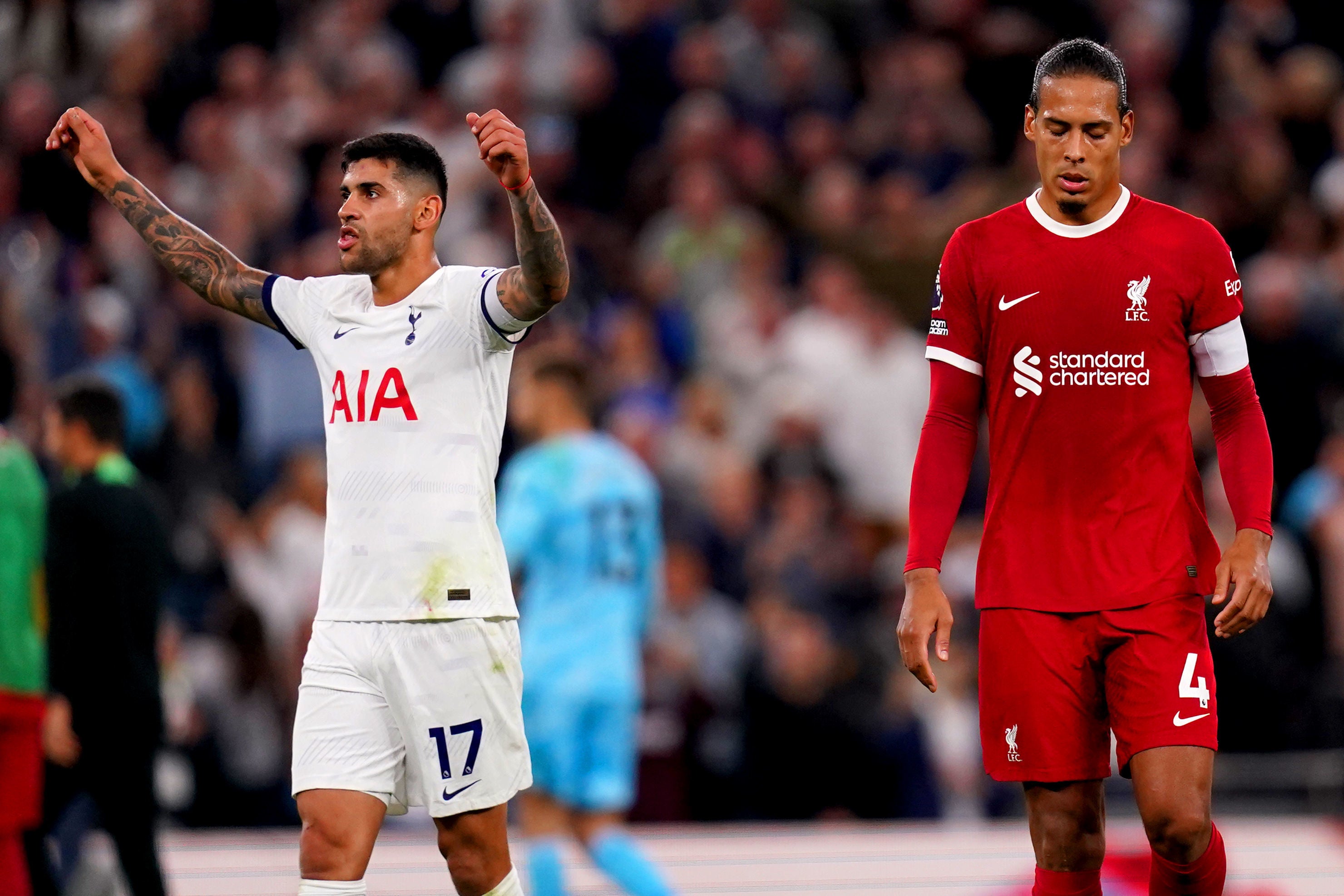 Joy and despair as Cristian Romero, left, celebrates for Spurs while Virgil van Dijk walks off