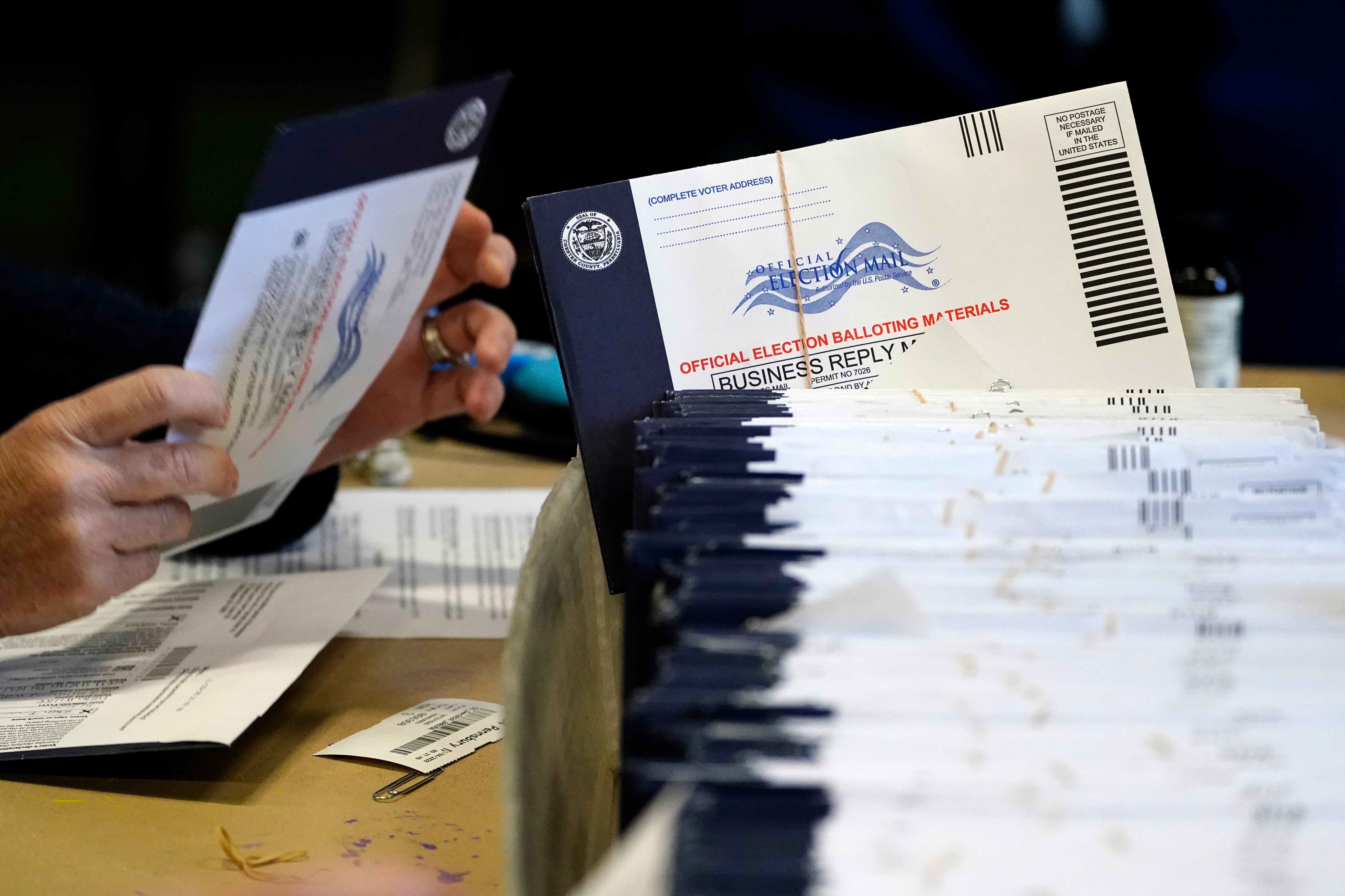 Chester County, Pa. election workers process mail-in and absentee ballots at West Chester University in West Chester on Nov. 4, 2020