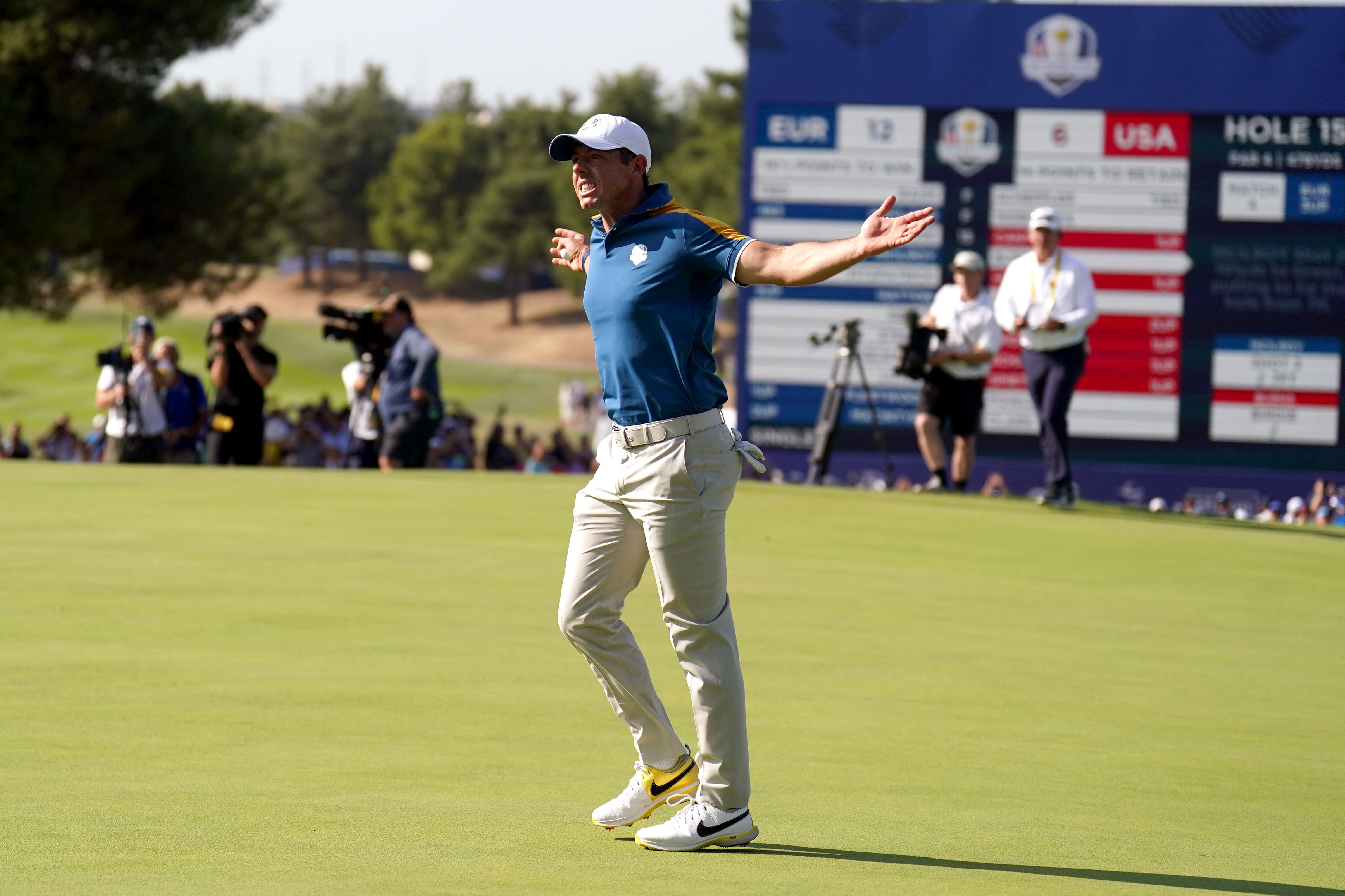 Rory McIlroy celebrates after holing his putt on the 15th hole (Zac Goodwin/PA)