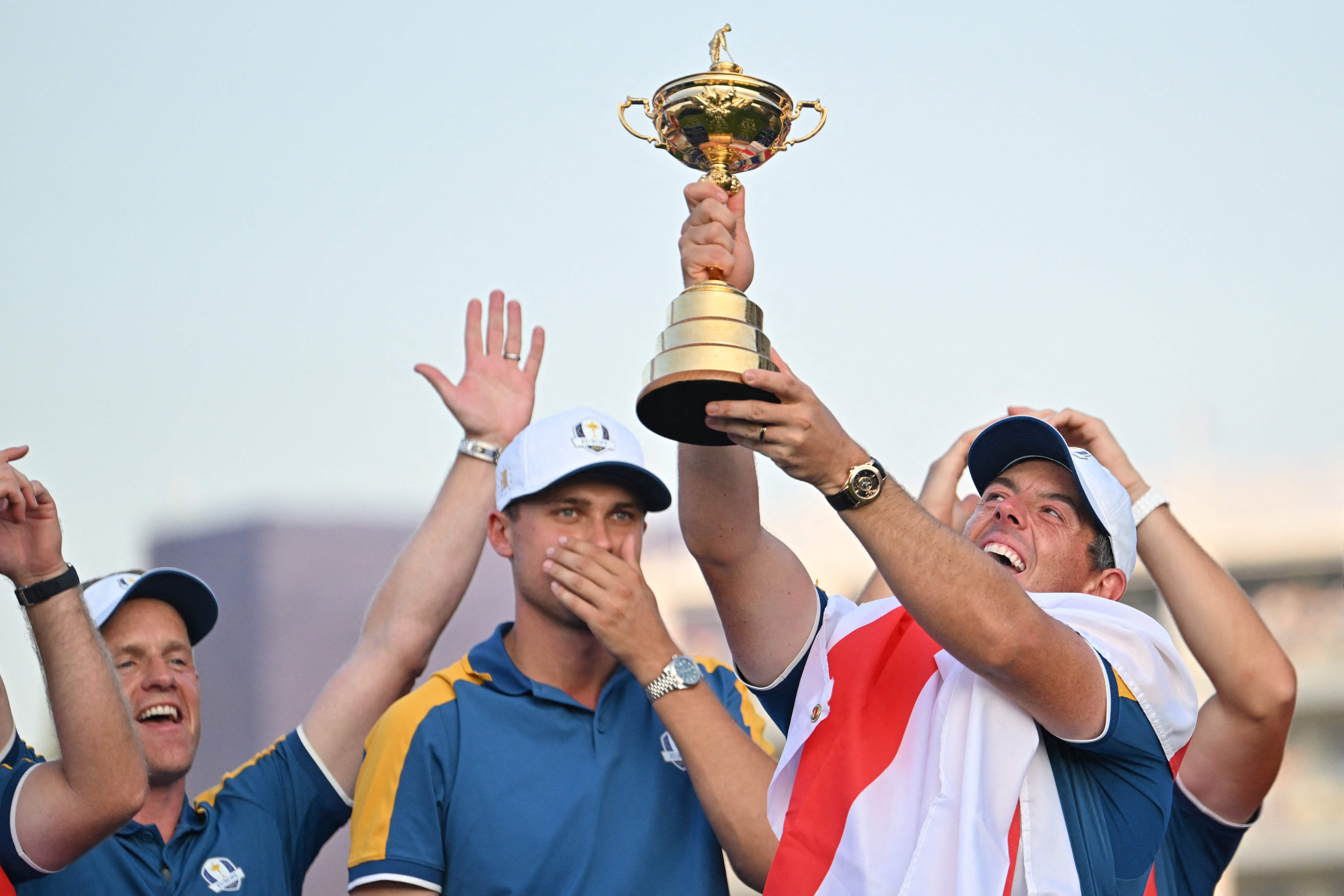 Rory McIlroy holds up the trophy