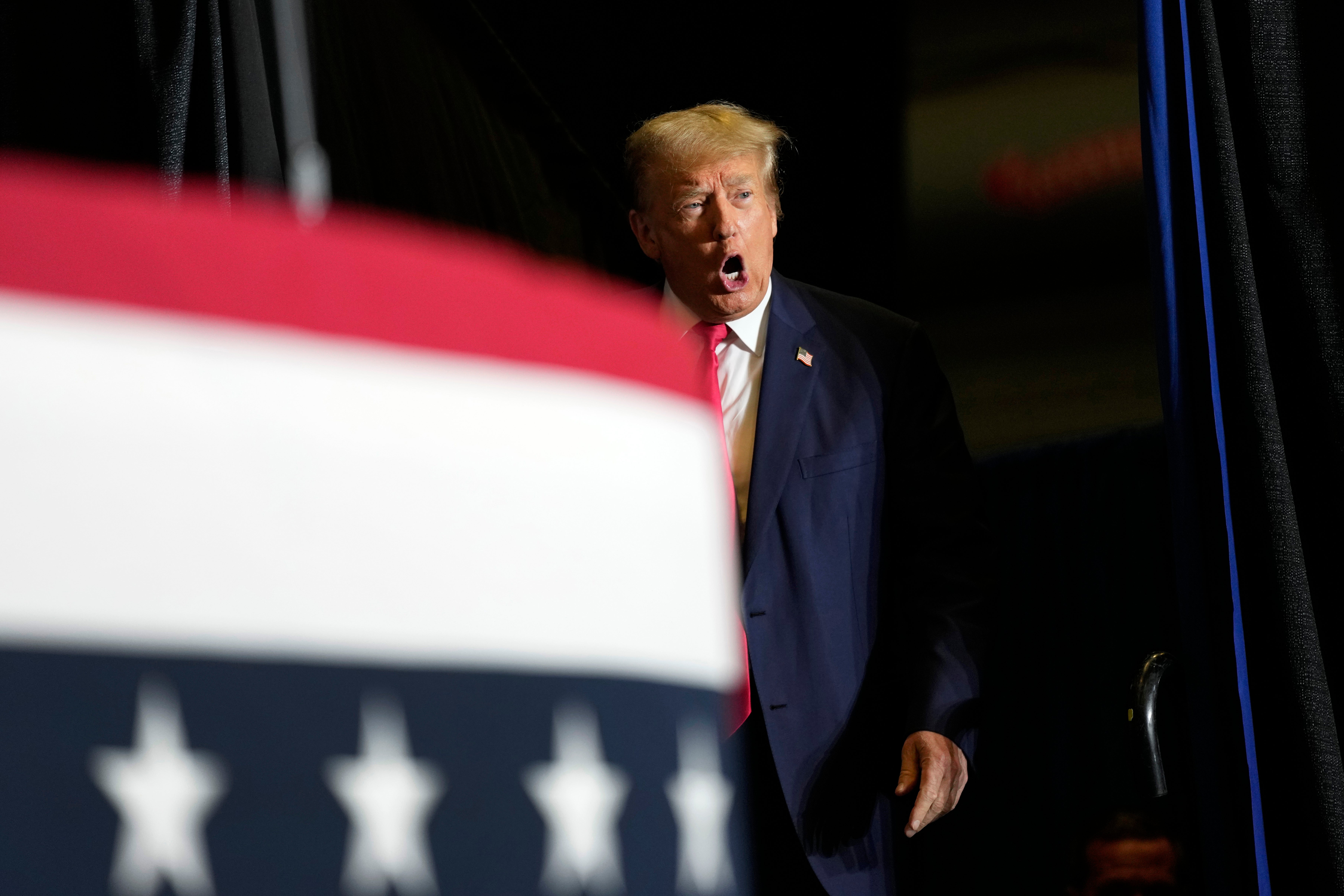 Former President Donald Trump arrives at a rally in Ottumwa, Iowa, on Sunday