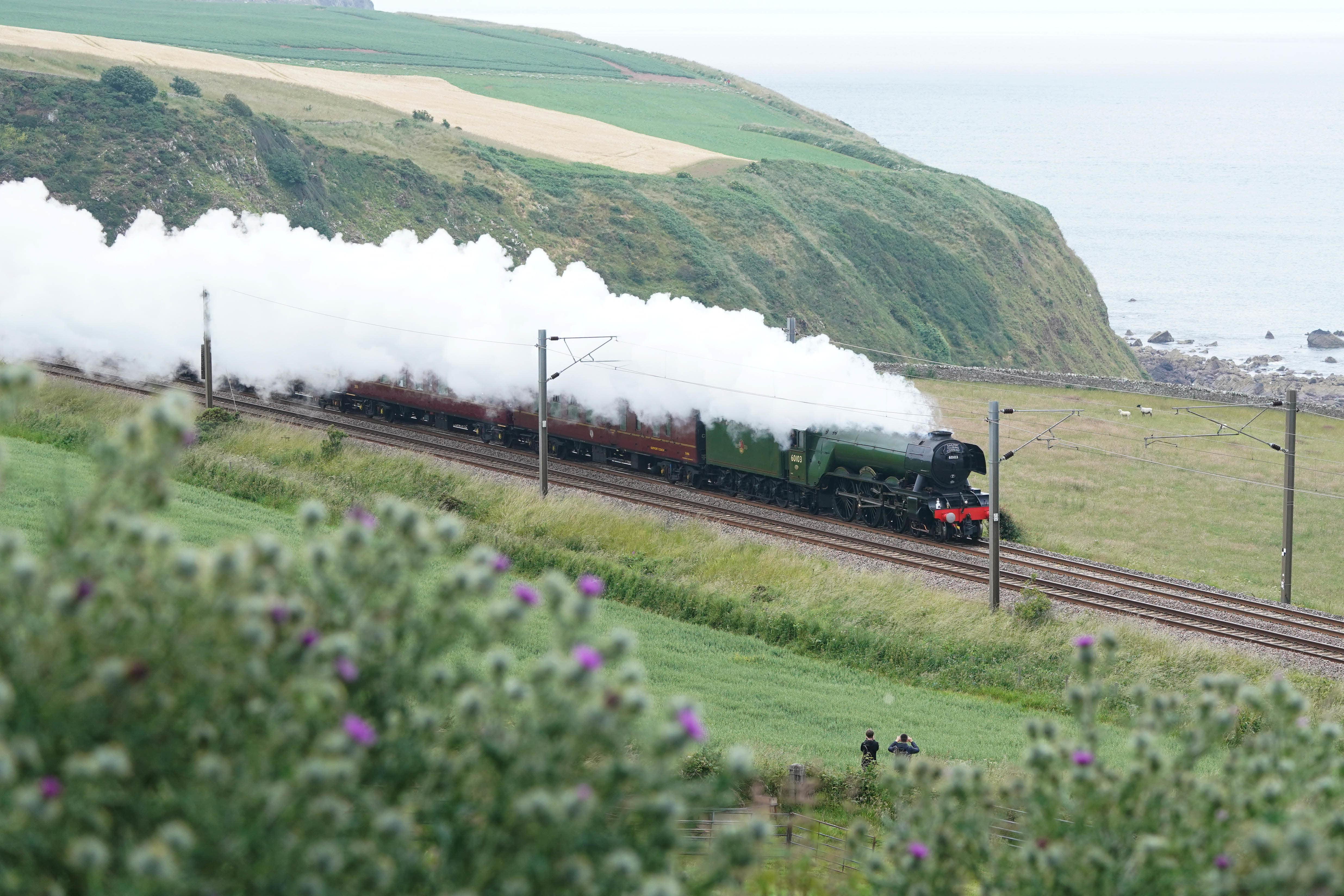 The Flying Scotsman passes near Berwick-upon-Tweed (Owen Humphreys/PA Wire)