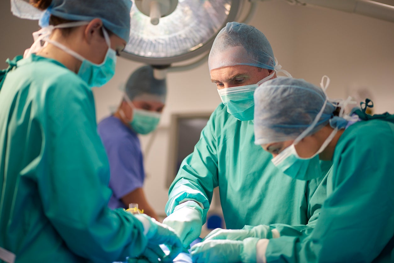 File photo: Surgeons work on a patient