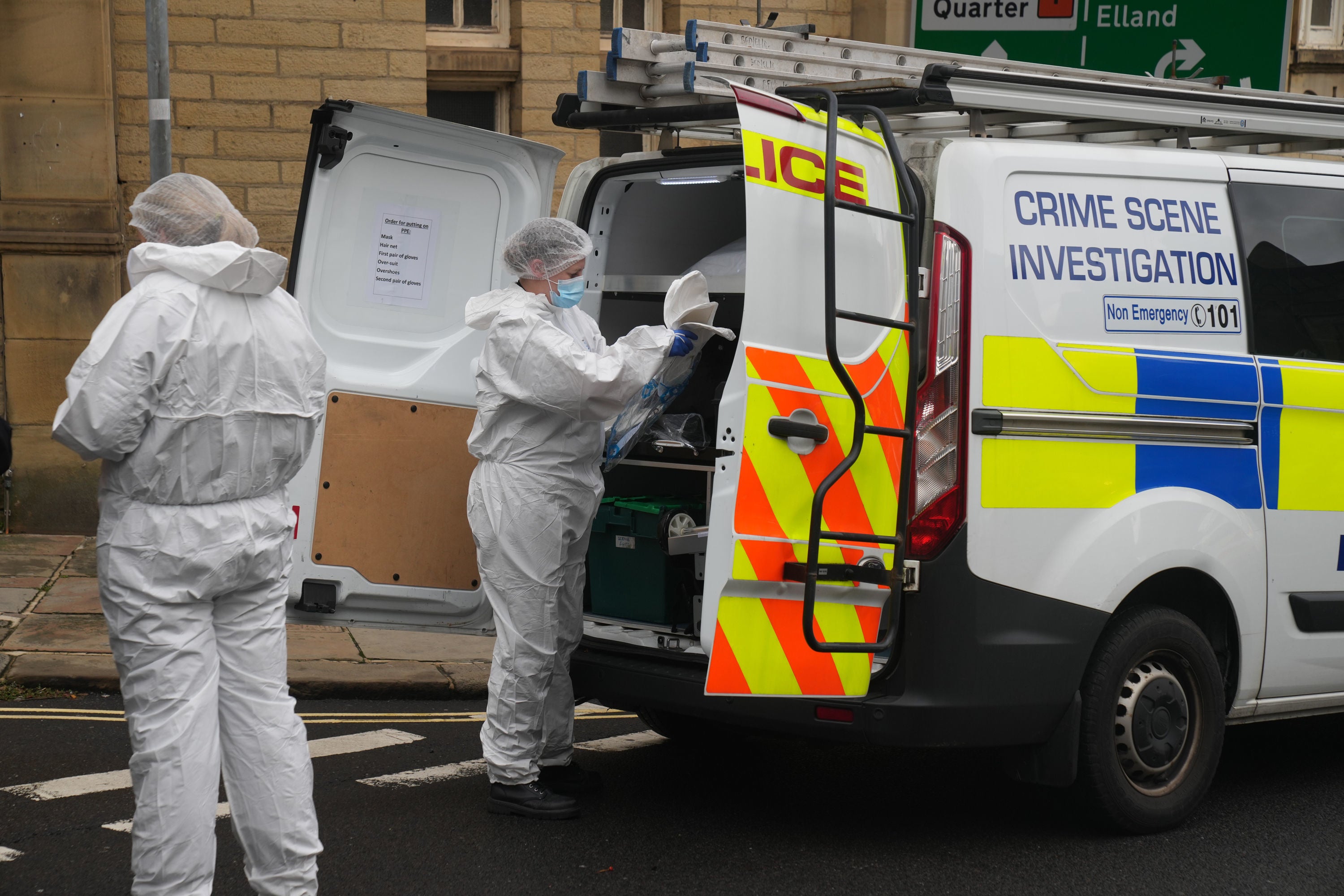 Police activity in Trinity Road, near to the scene of a triple stabbing in Halifax