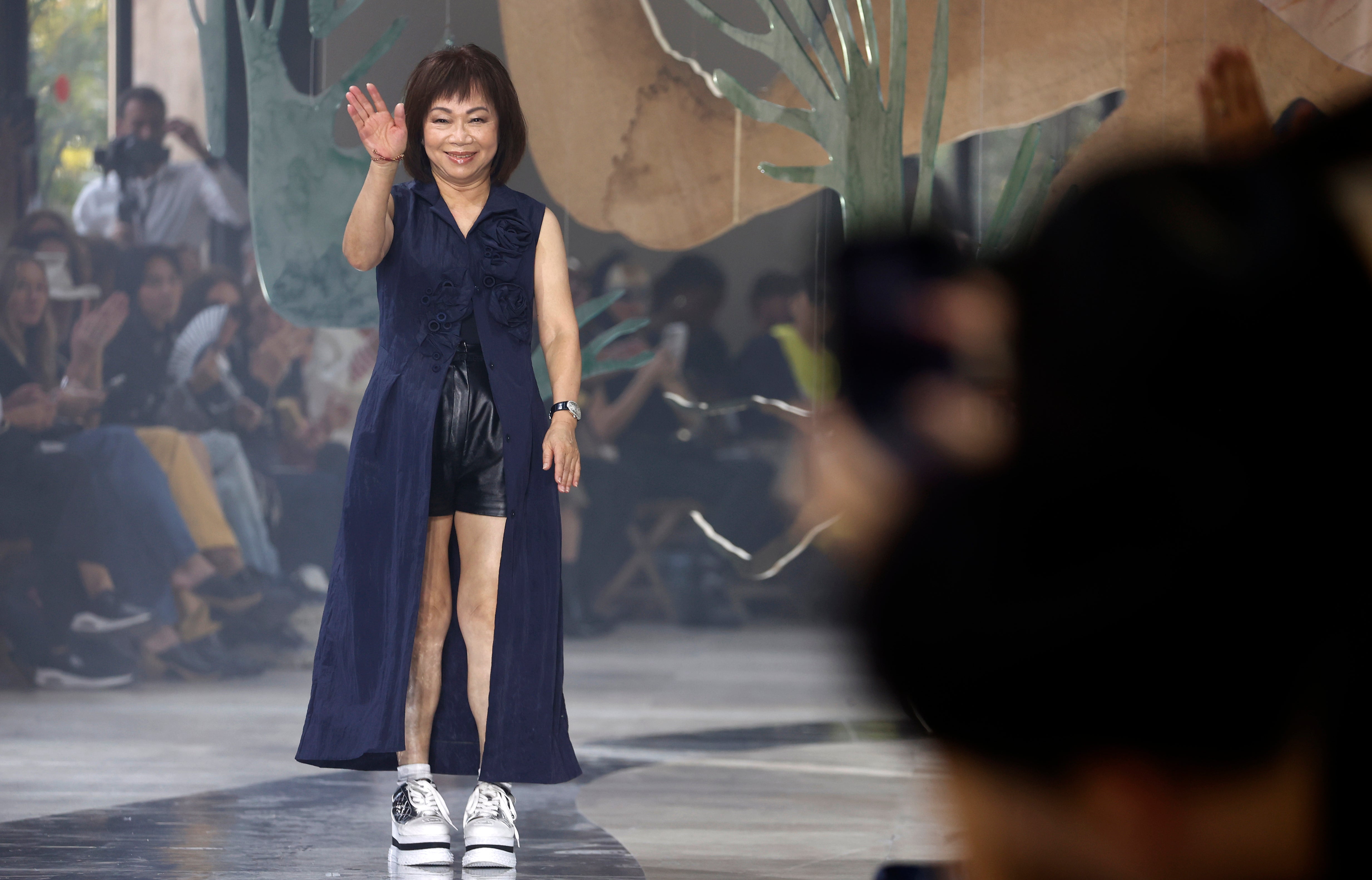 Wang Chen Tsai-Hsia, founder of Shiatzy Chen, greets the audience at the end of its show wearing a dress from the SC resort 24 collection.