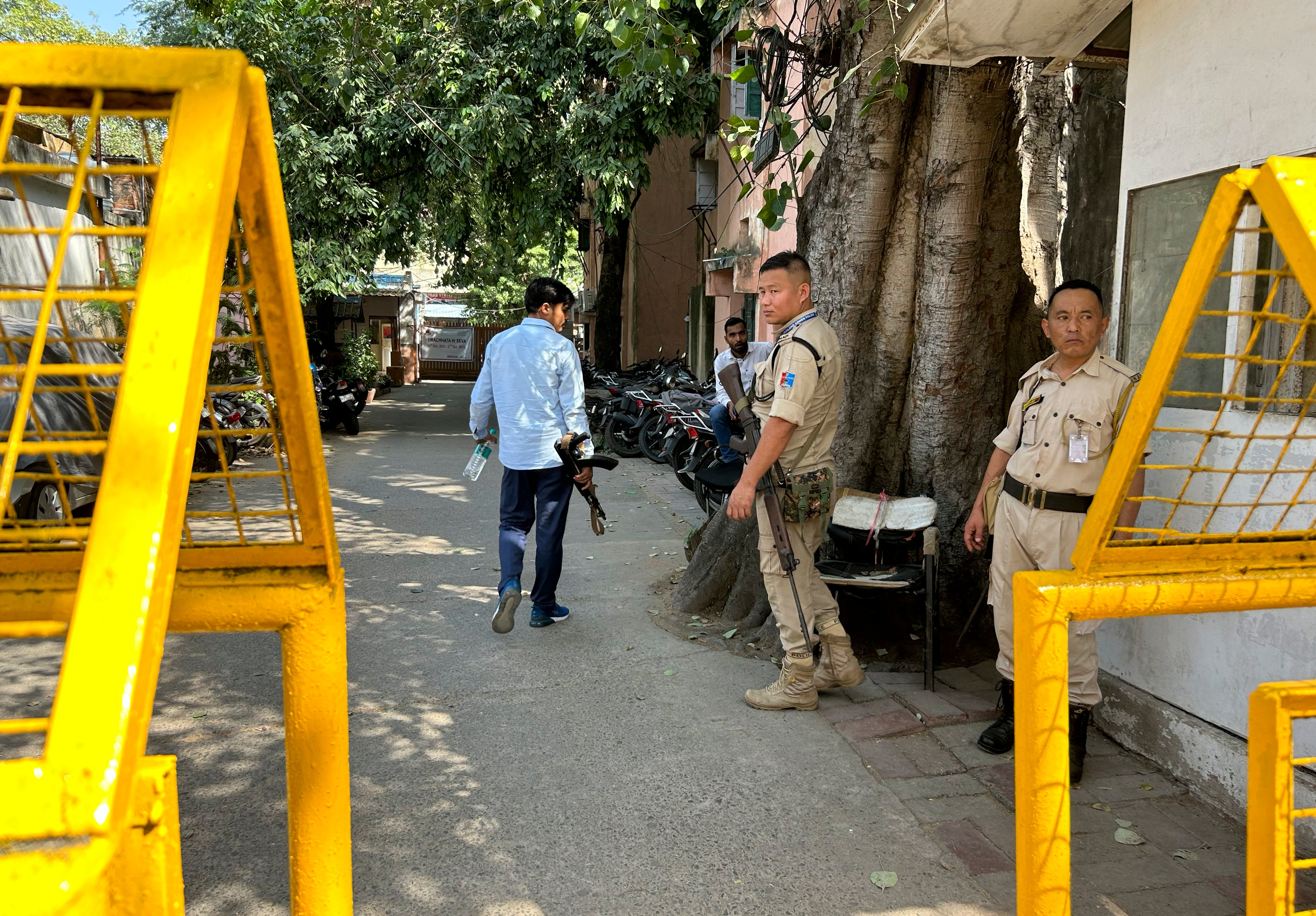 Security officers stand guard outside the office of Delhi Police’s Special Cell in New Delhi, India, Tuesday, 3 October 2023