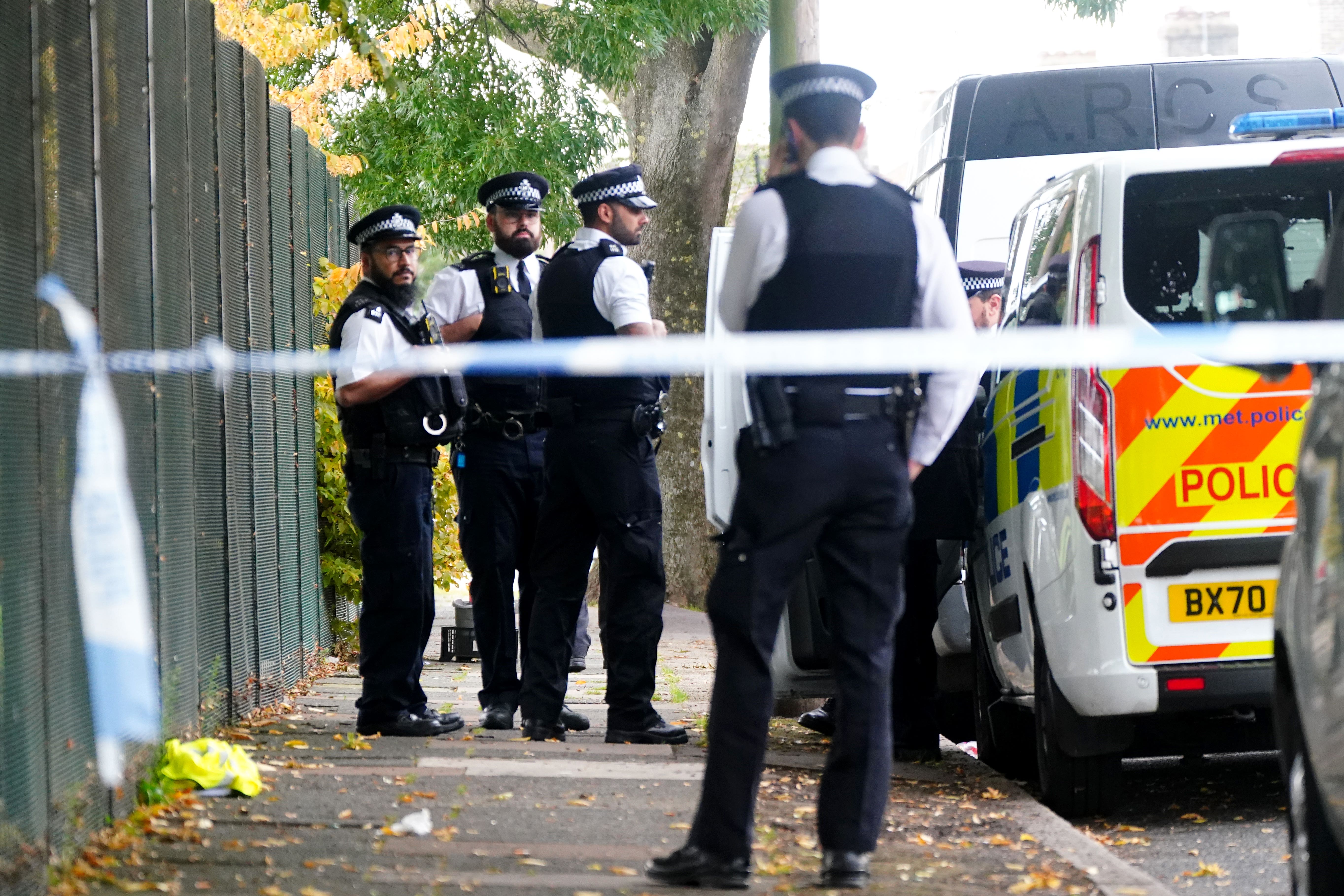 Metropolitan Police officers at the scene where a 16-year-old boy was stabbed to death just before 11.30pm on Sunday in Kendal Gardens, Edmonton (Victoria Jones/PA)