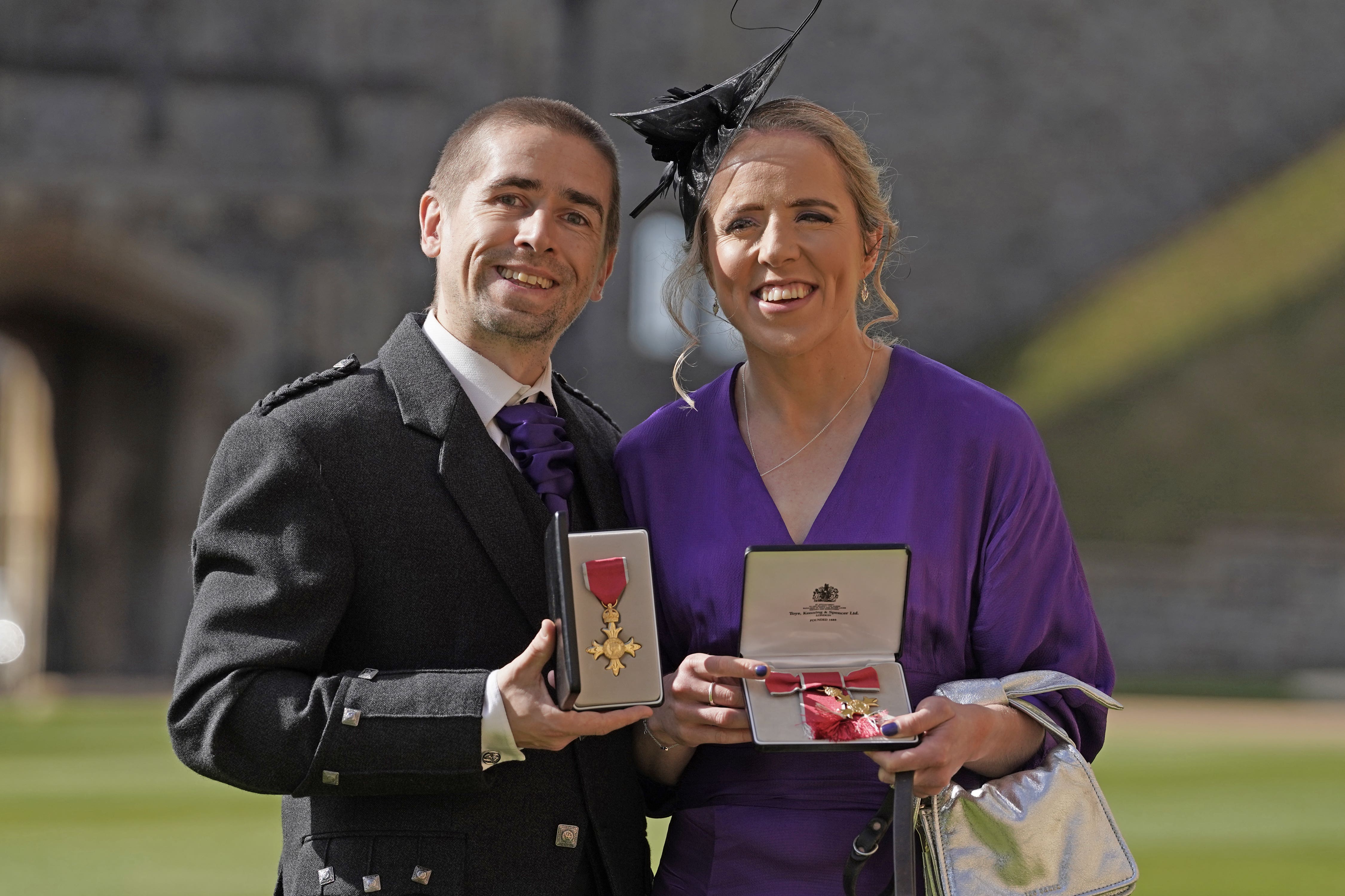 Neil Fachie and Lora Fachie show off their medals (Yui Mok/PA)