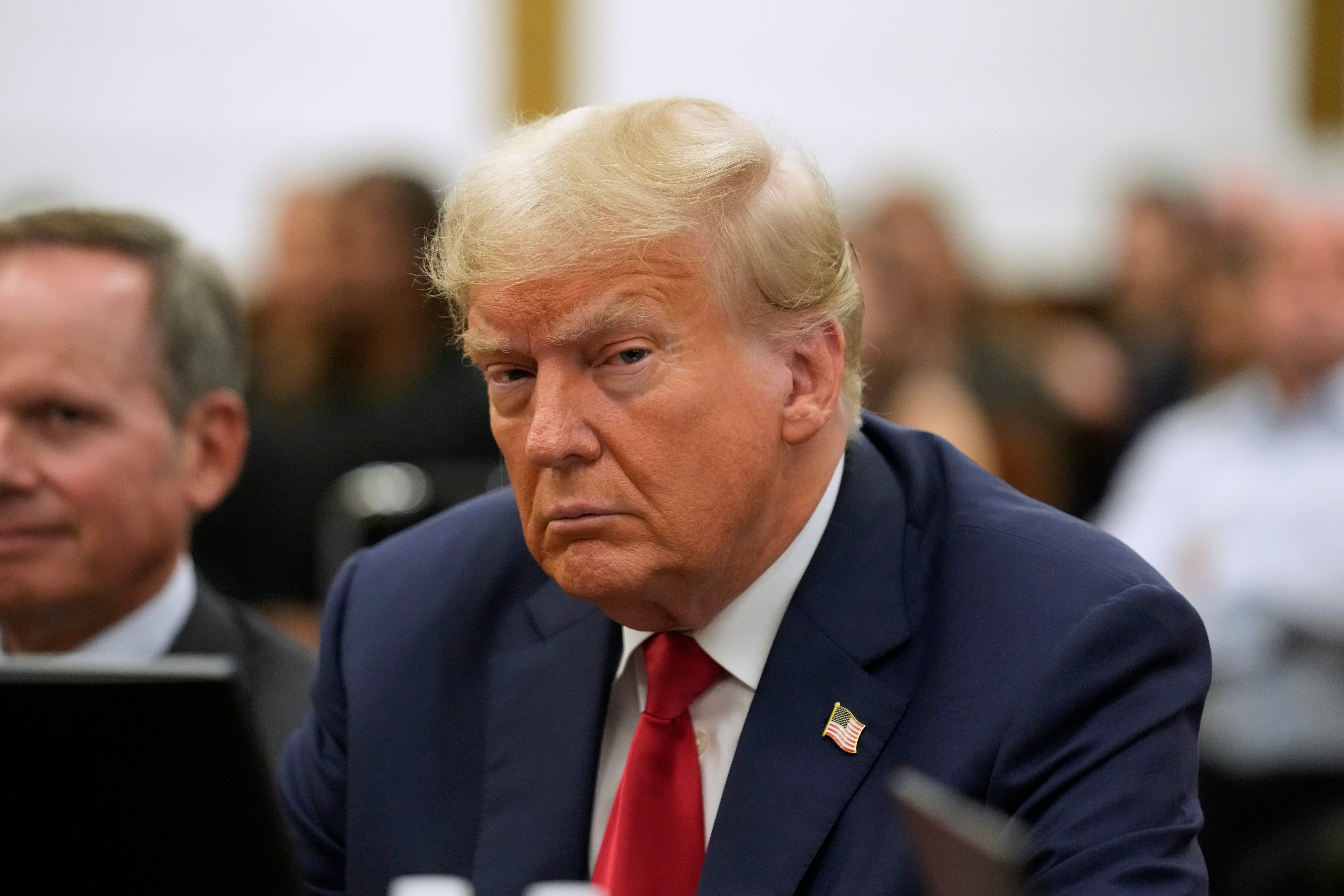 Donald Trump appears in court with his attorney Christopher Kise on 3 October