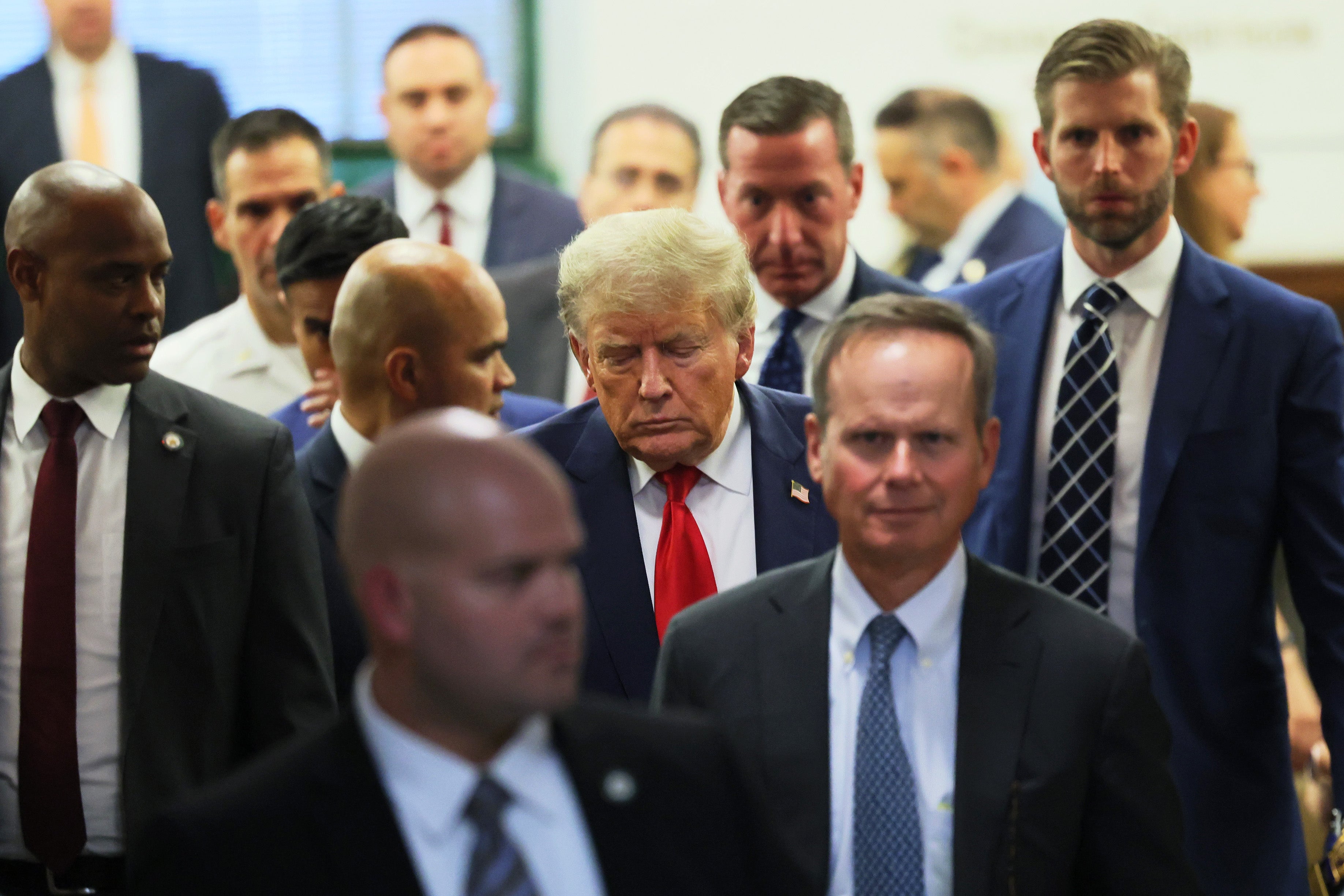 Donald Trump leaves a Manhattan court room on 3 October.