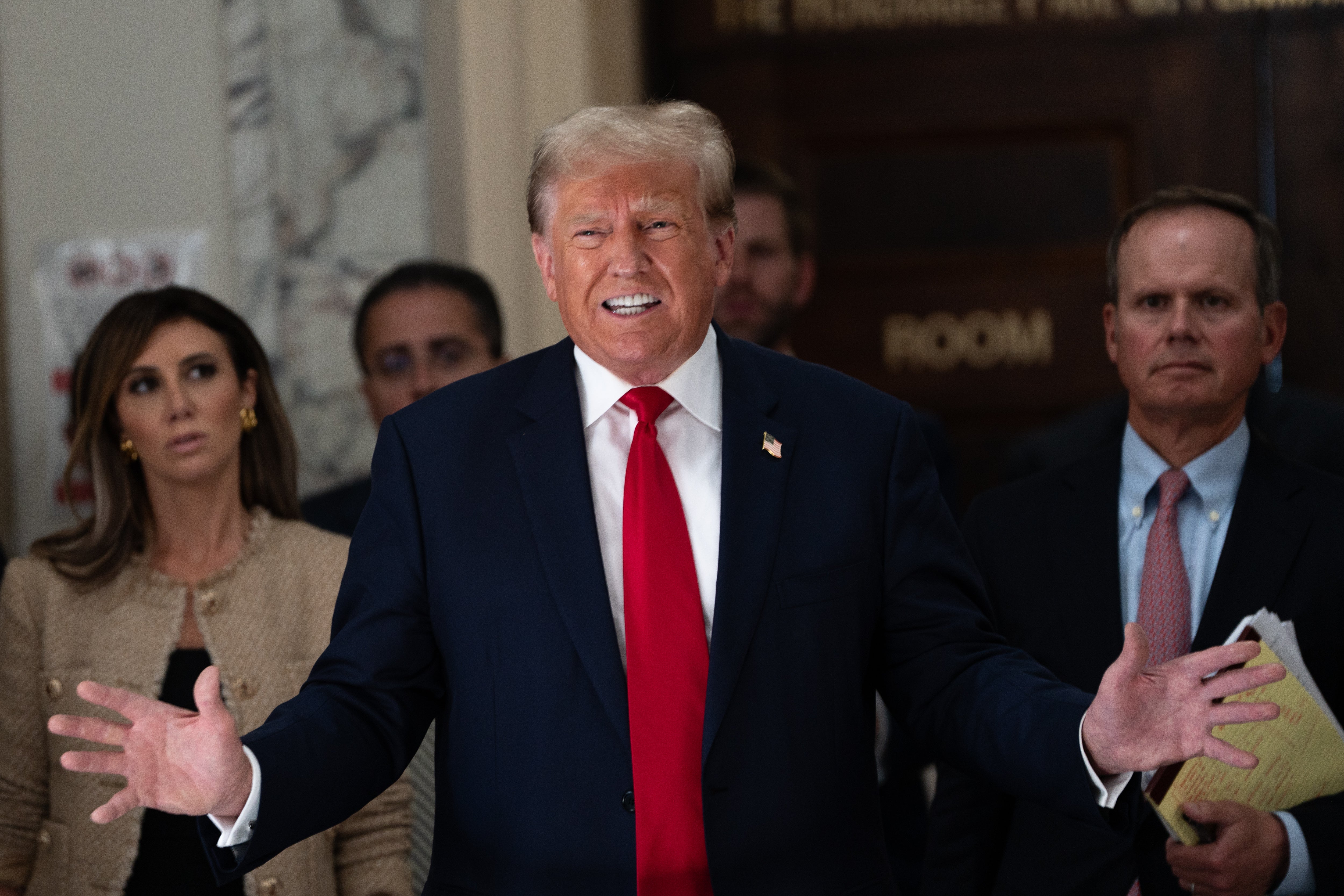 Donald Trump addresses the media during a lunch break on the third day of his civil fraud trial at New York State Supreme Court