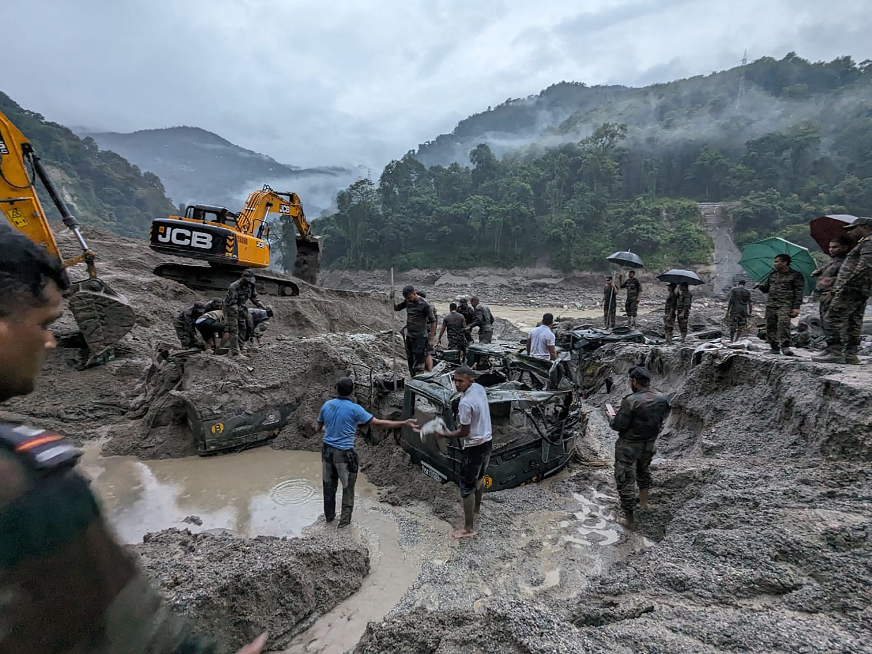 This handout picture released by India’s Ministry of Defence on 5 October 2023, shows Indian army personnel conduct a search operation for the missing soldiers in north Sikkim