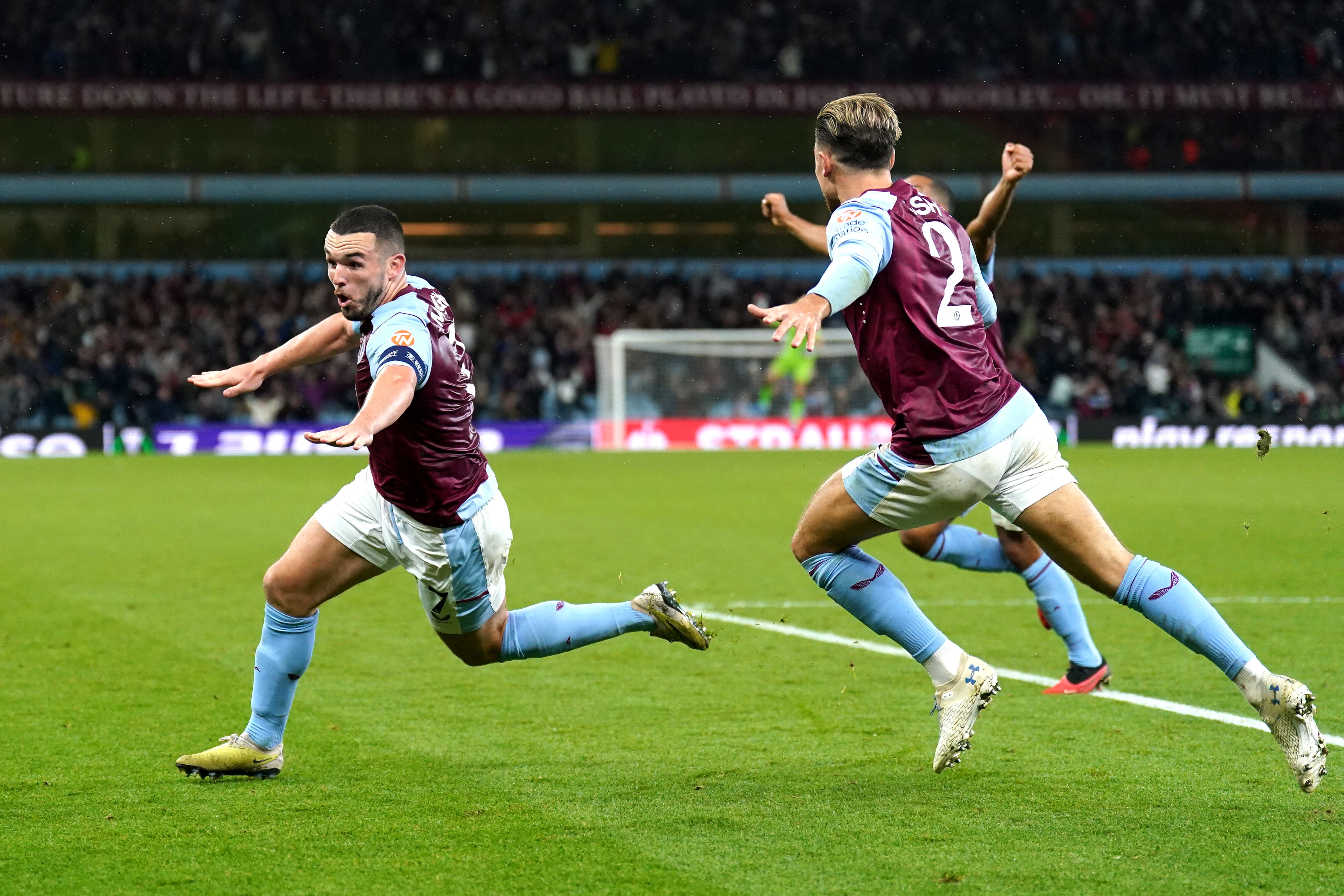 Aston Villa’s John McGinn (left) celebrates his late winner (PA)