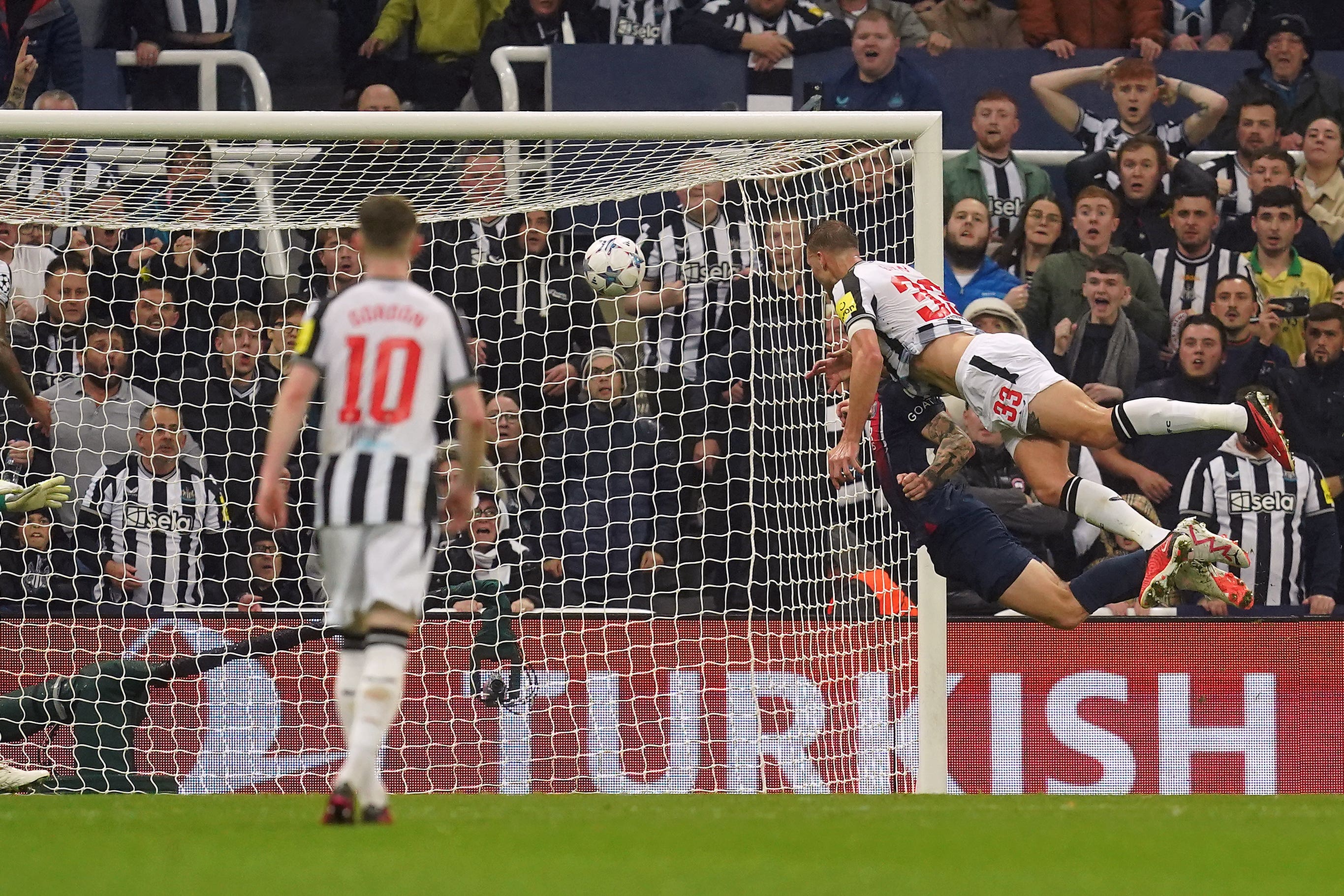 Dan Burn heads Newcastle into a 2-0 Champions League lead over Paris St Germain (Martin Rickett/PA)