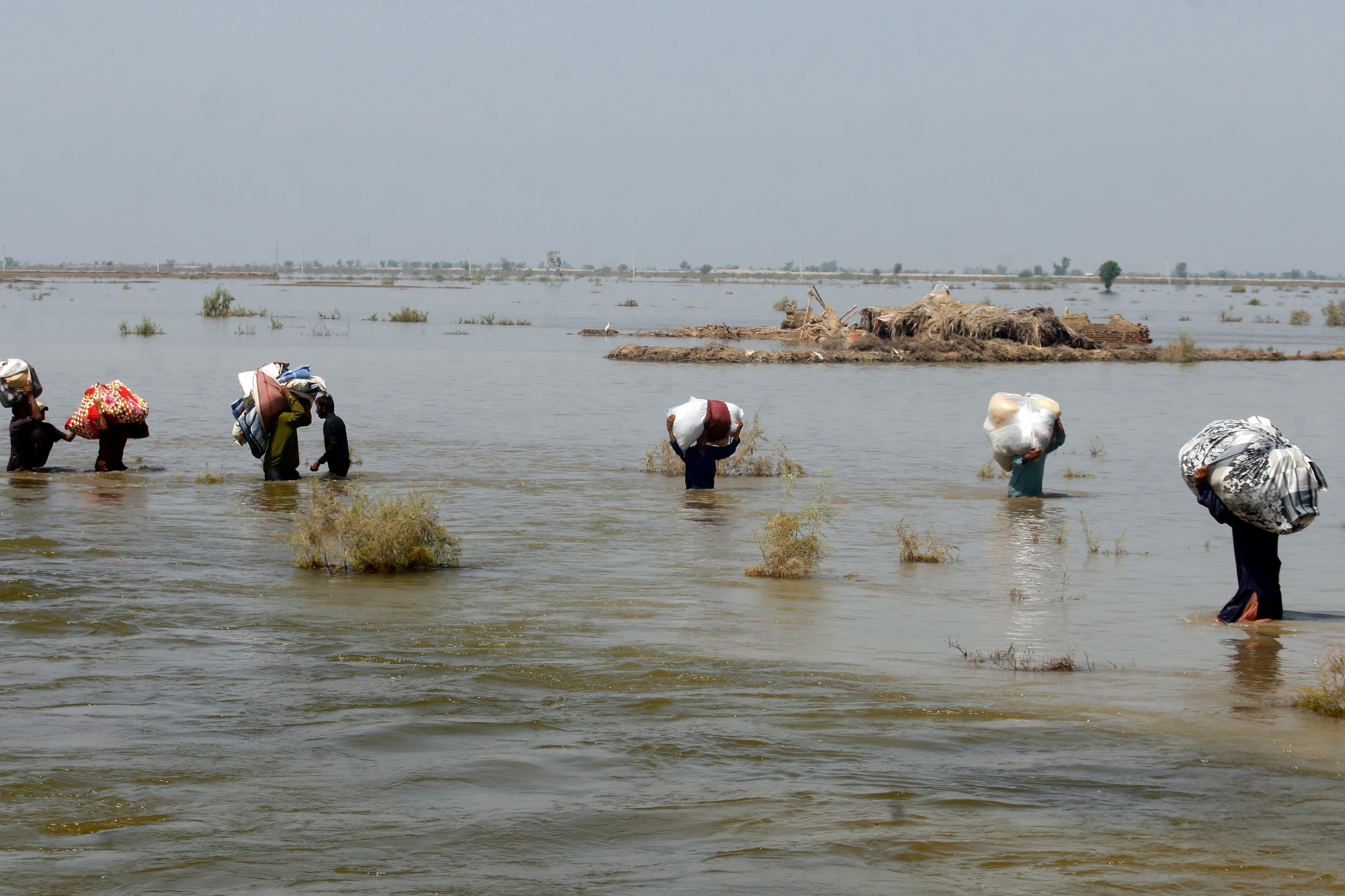 Flooding was responsible for 95% of child displacements between 2016 and 2021 (Fareed Khan/AP)