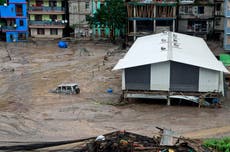 Icy floodwaters burst through major dam in India's northeast, killing at least 31 people