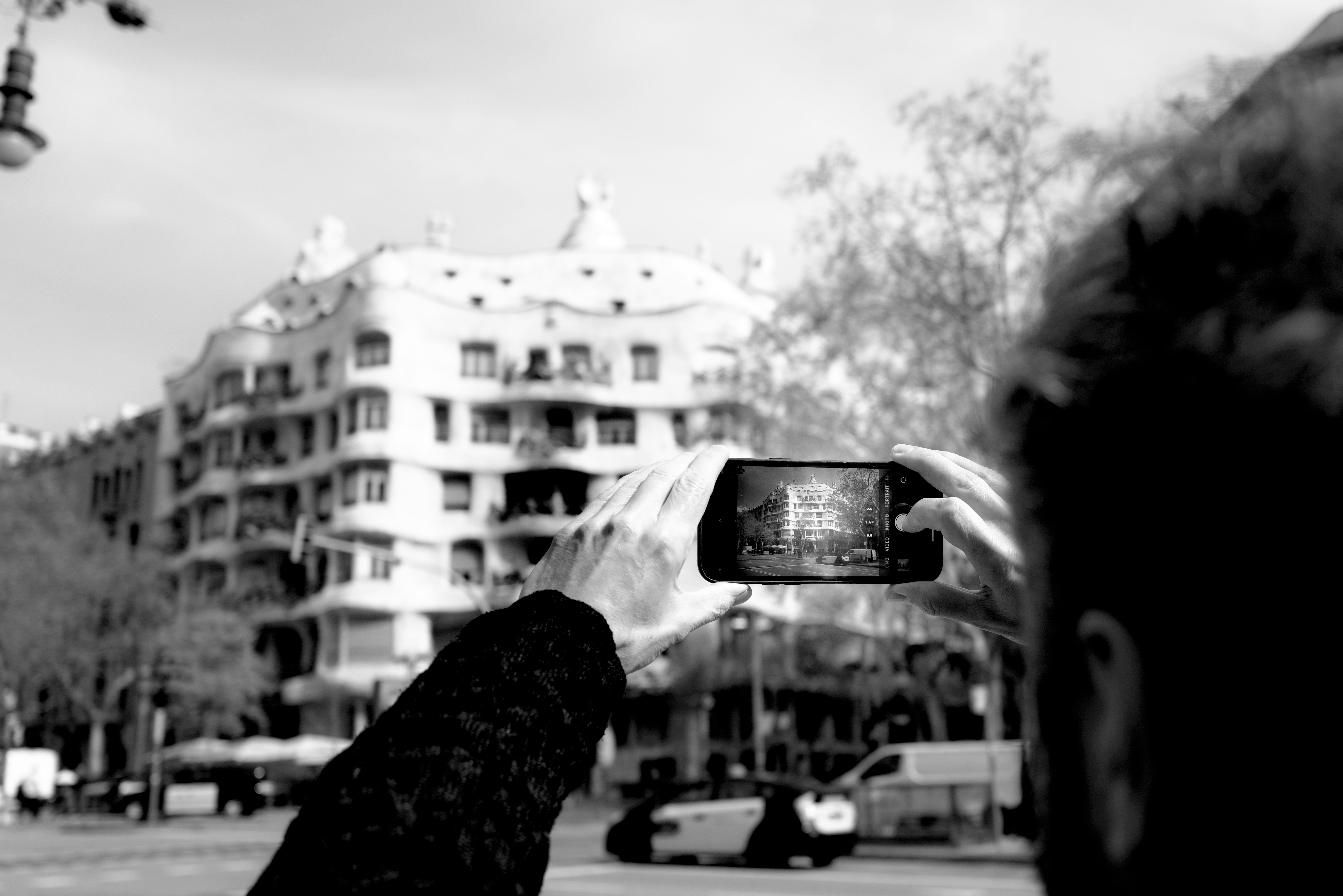 Thomas taking a picture of Casa Milà