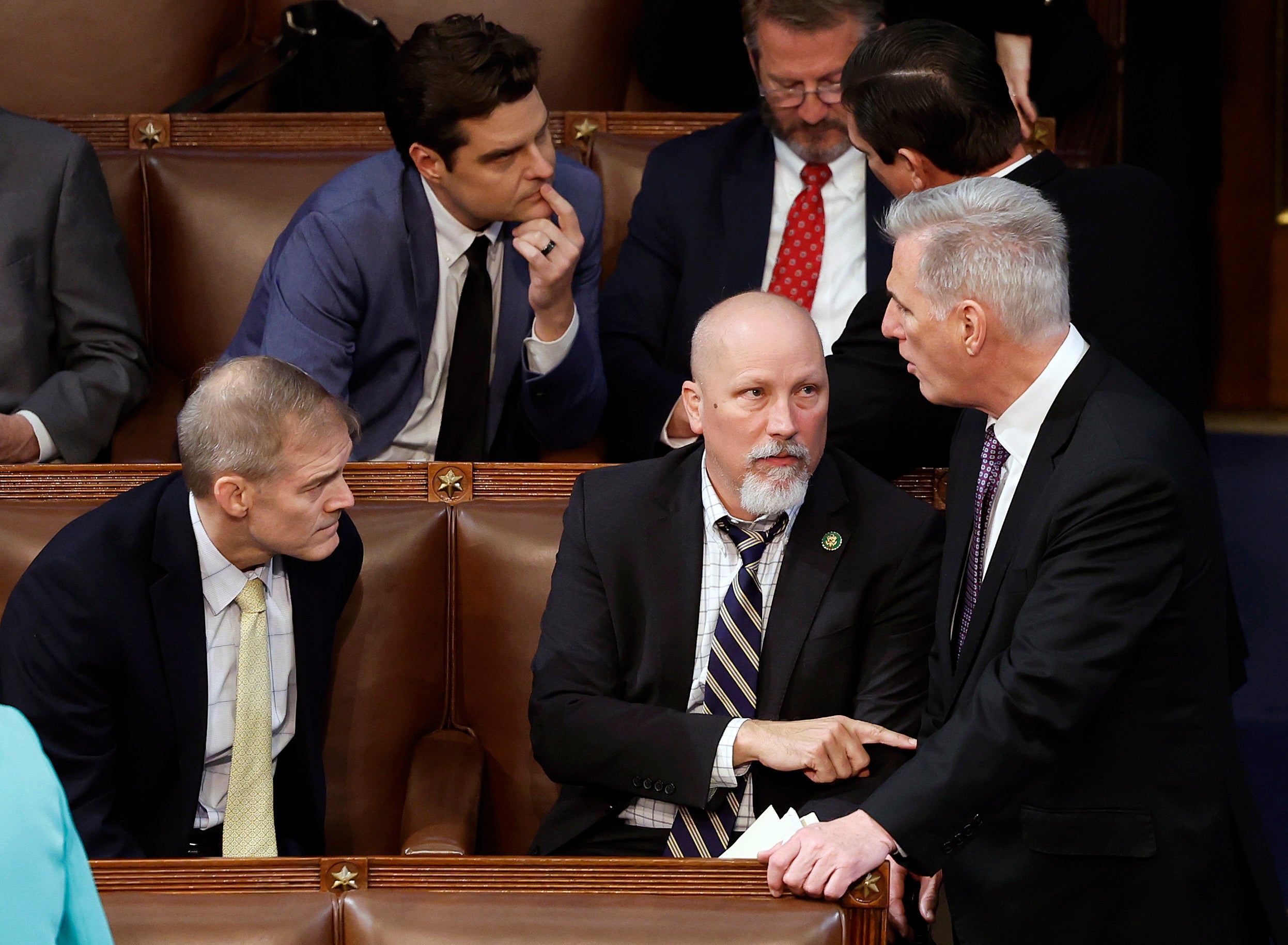 U.S. House Republican Leader Kevin McCarthy (R-CA) (R) talks to Rep. Chip Roy (R-TX) (C) and Rep. Jim Jordan (R-OH) in the House Chamber during the second day of elections for Speaker of the House at the U.S. Capitol Building on January 04, 2023 in Washington, DC.