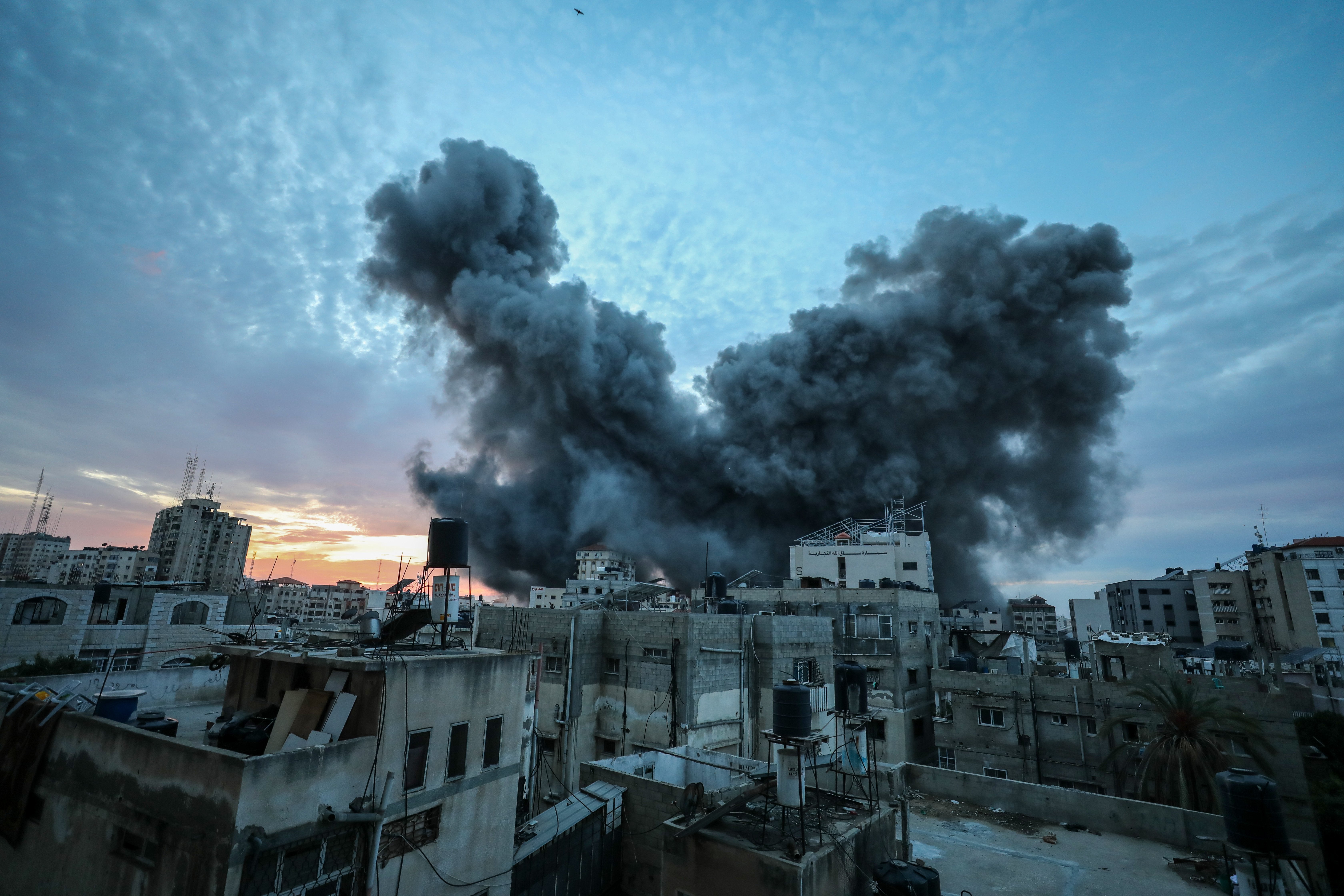 A ball of smoke rises from an explosion on a Palestinian tower following an Israeli airstrike in Gaza City