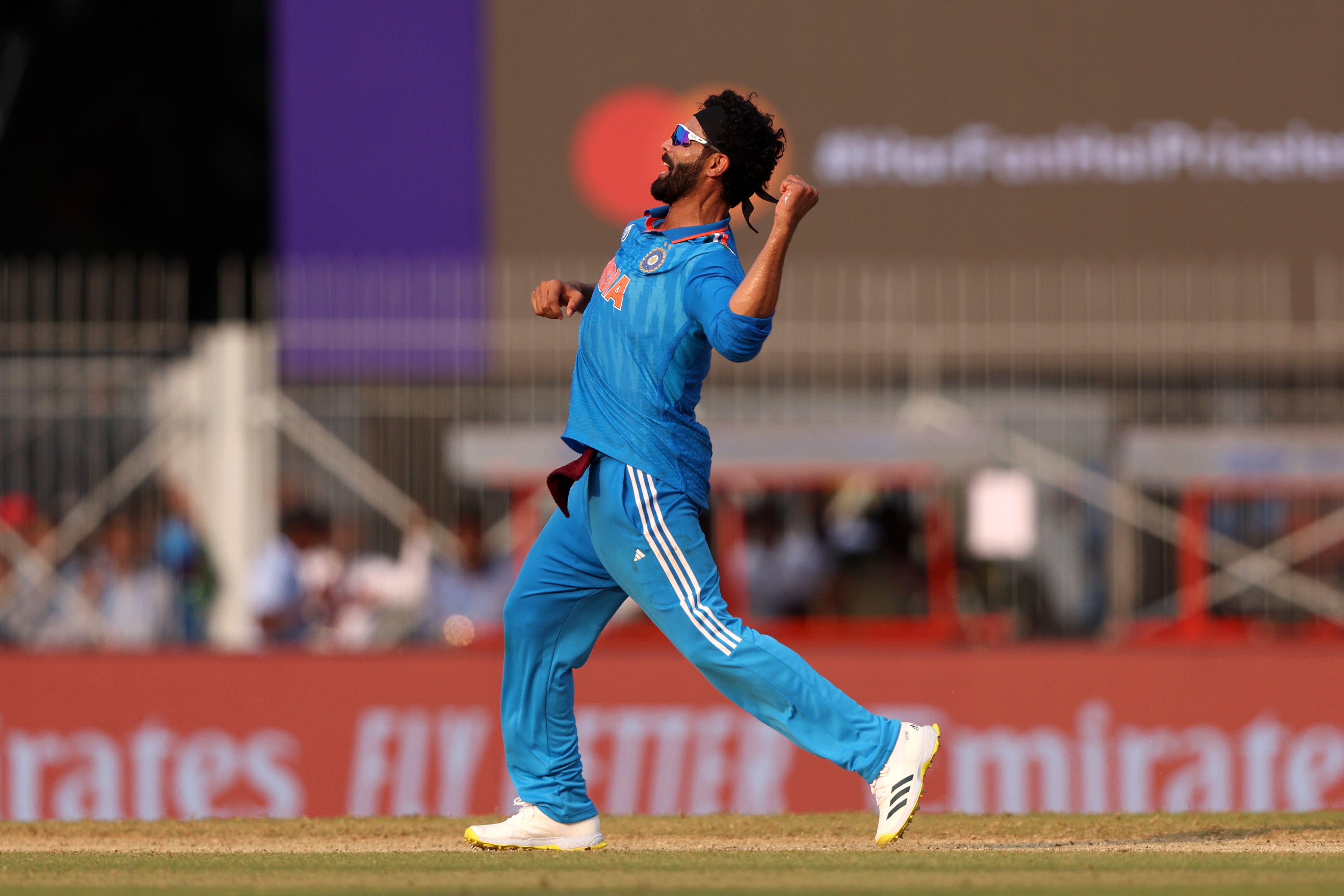 Jadeja celebrates taking the wicket of Alex Carey