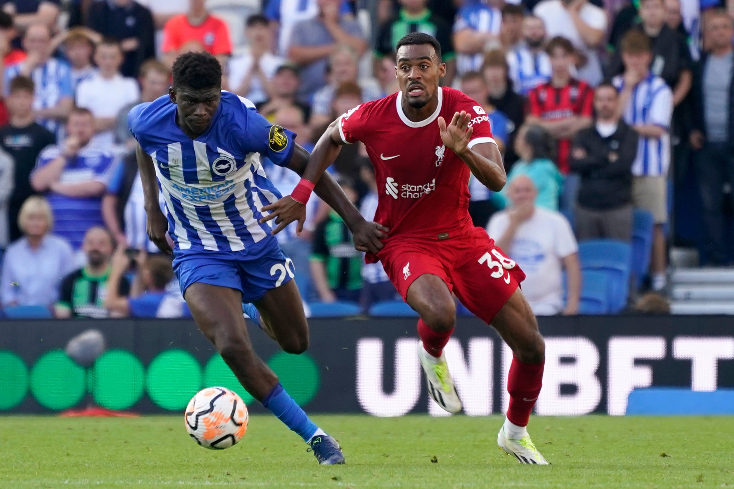 Carlos Baleba drives away from Liverpool’s Ryan Gravenberch