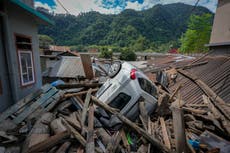Indian rescue copters are flying into region where flood washed out bridges and killed at least 52