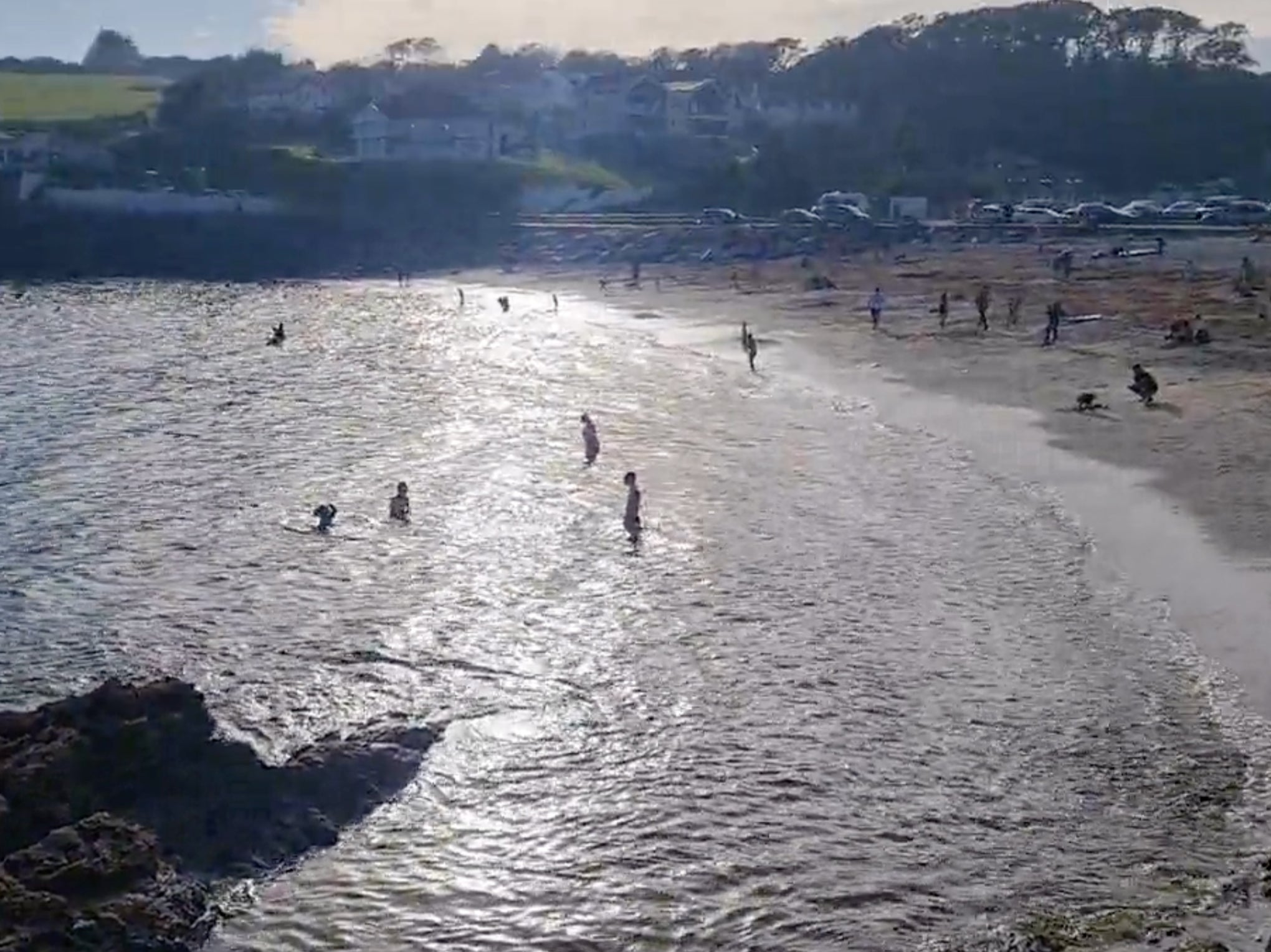 Children continue to play in the water