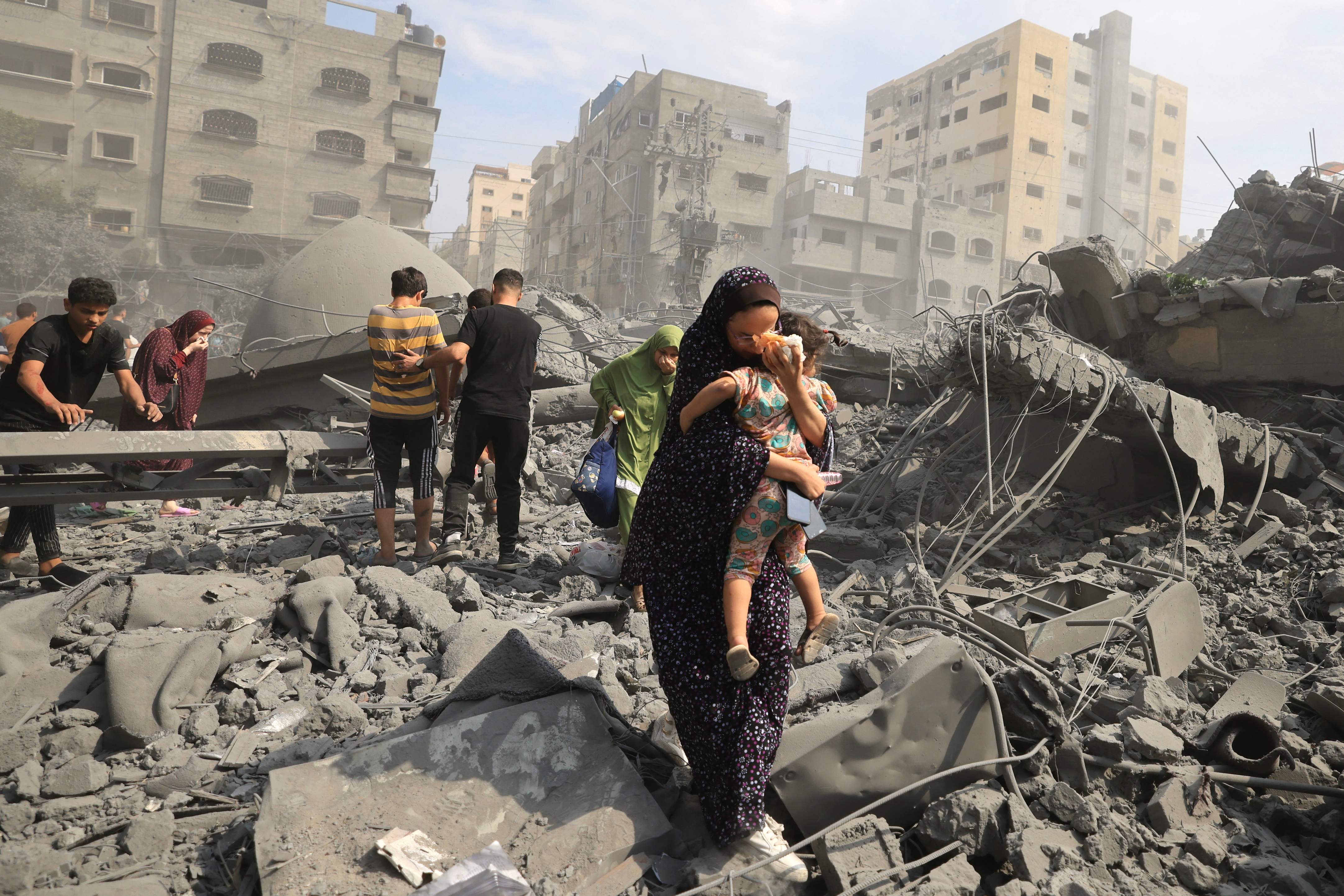 Palestinians evacuate the area following an Israeli airstrike on the Sousi mosque