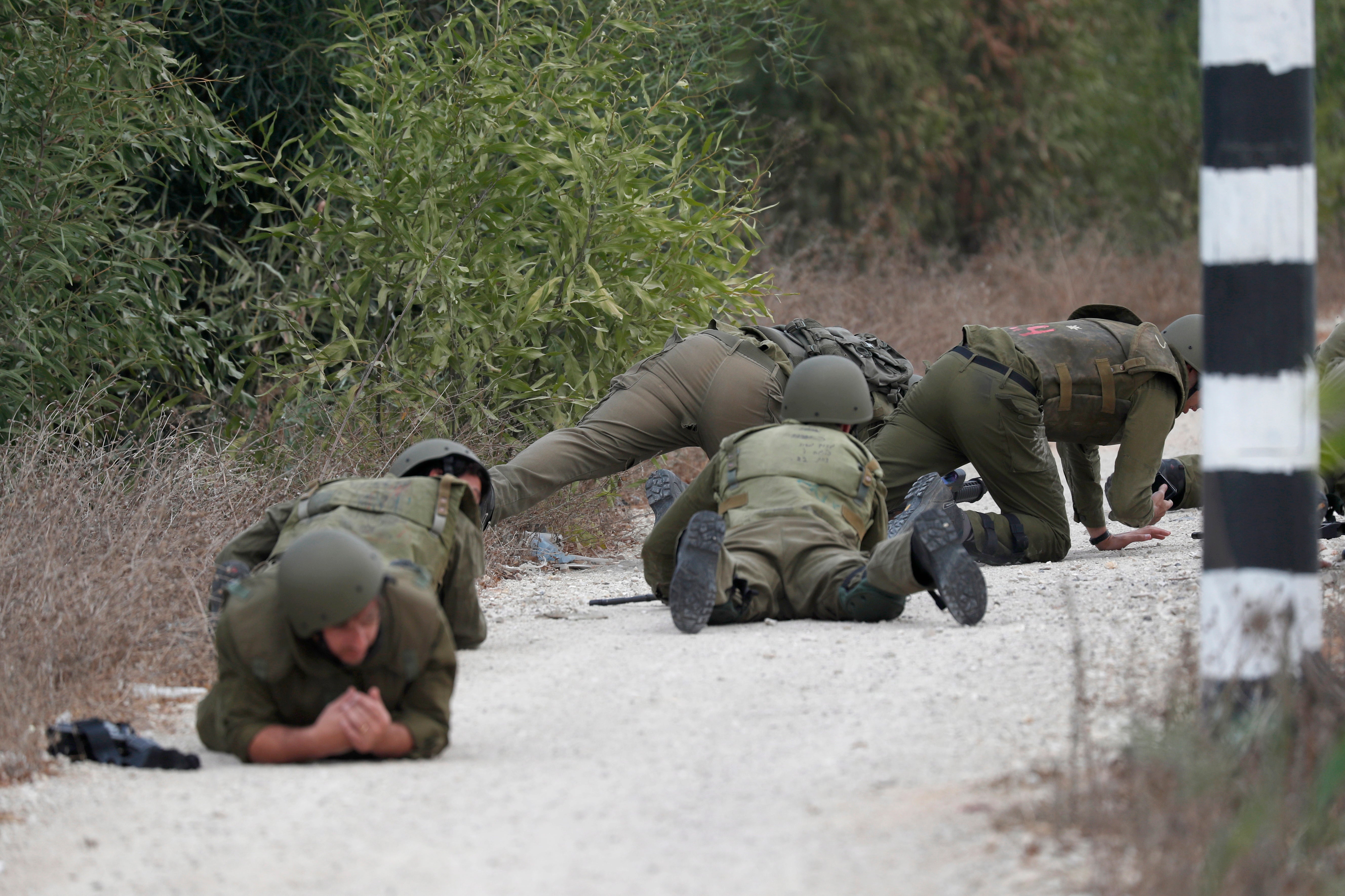 Israeli military tries to strengthen borders with Gaza as battle enters third day