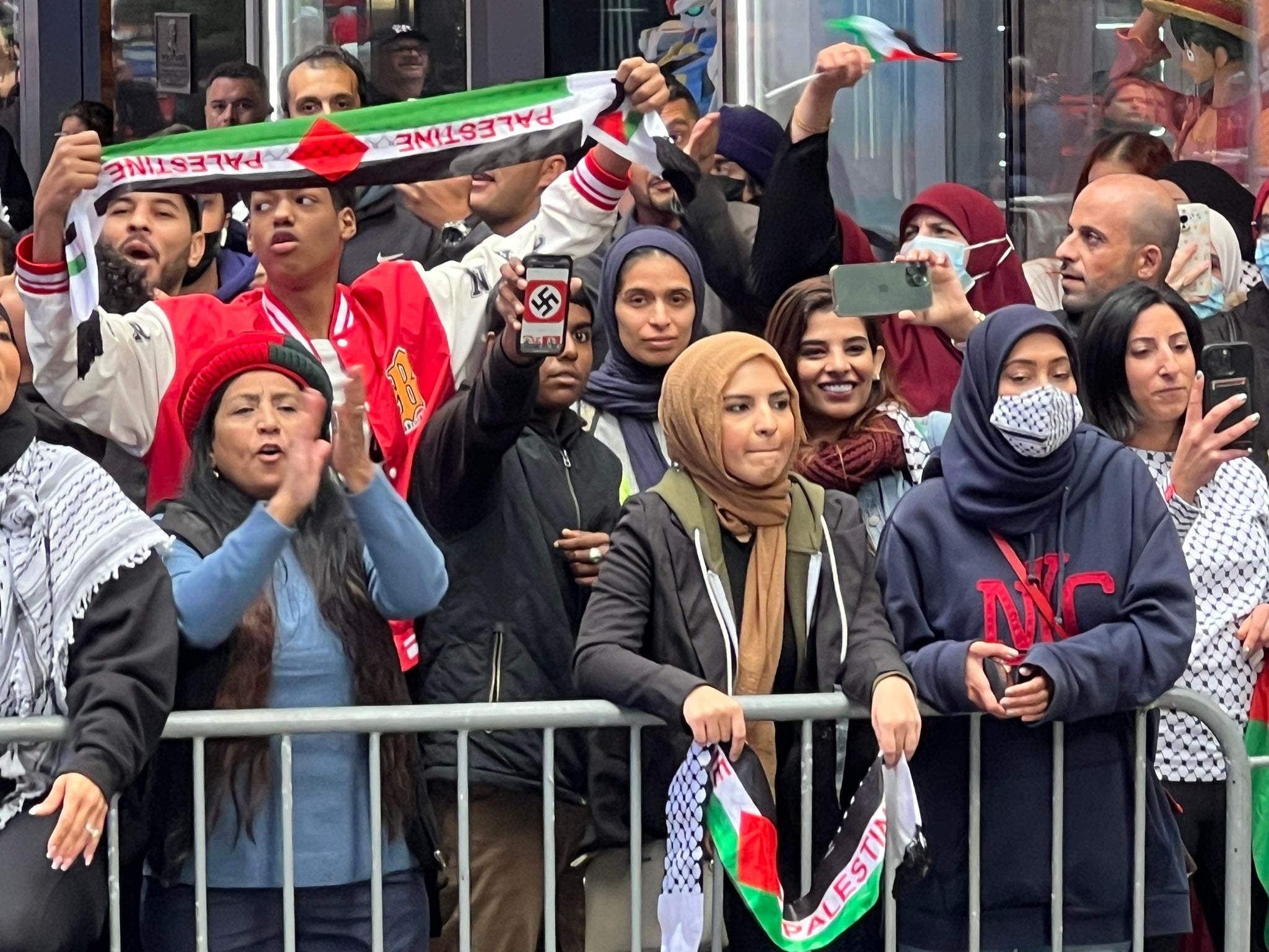 A protester was seen in Times Square brandishing a swastika