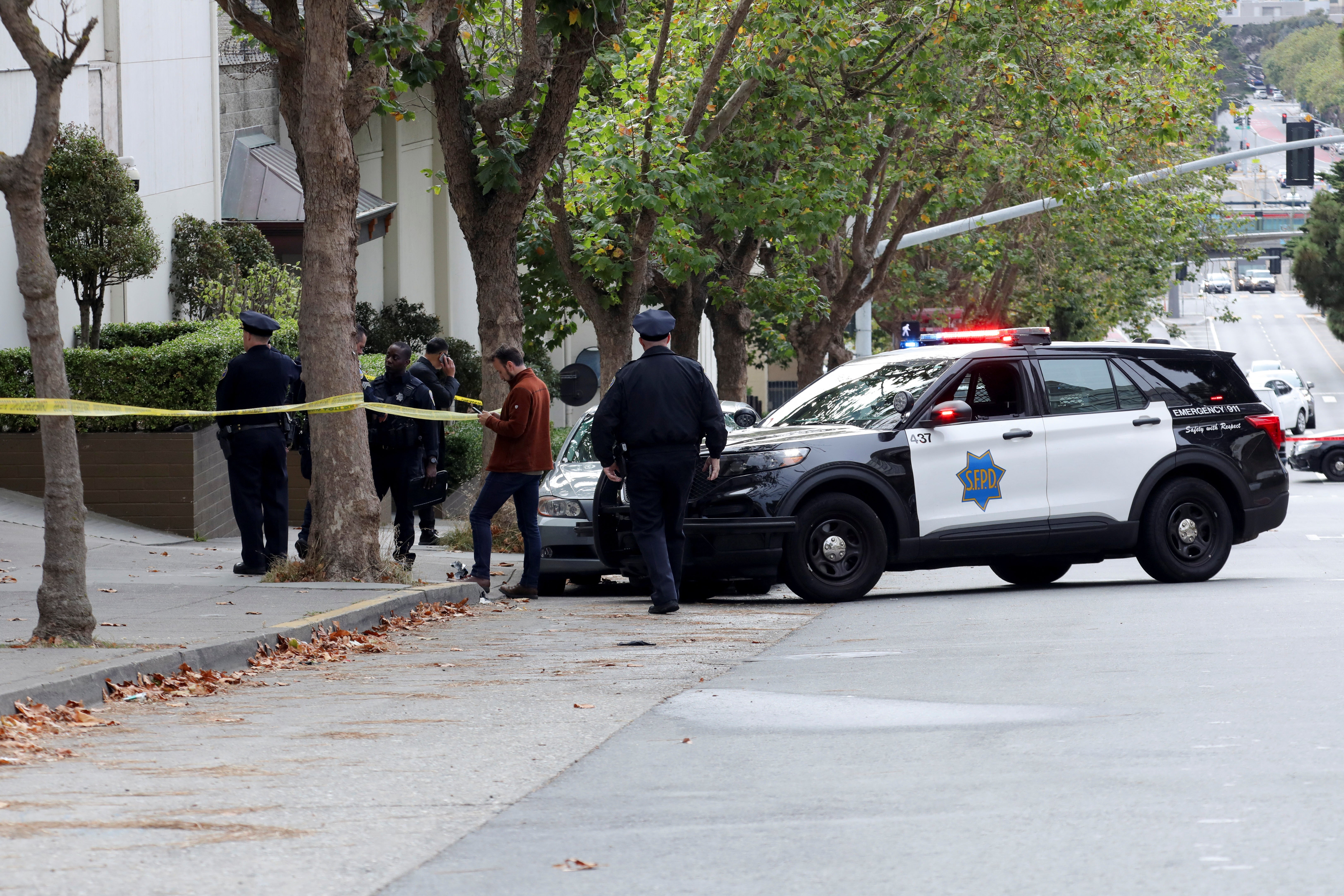 Law enforcement members stand on the street near the Chinese consulate, where local media has reported a vehicle may have crashed into the building, in San Francisco, California, U.S. October 9, 2023