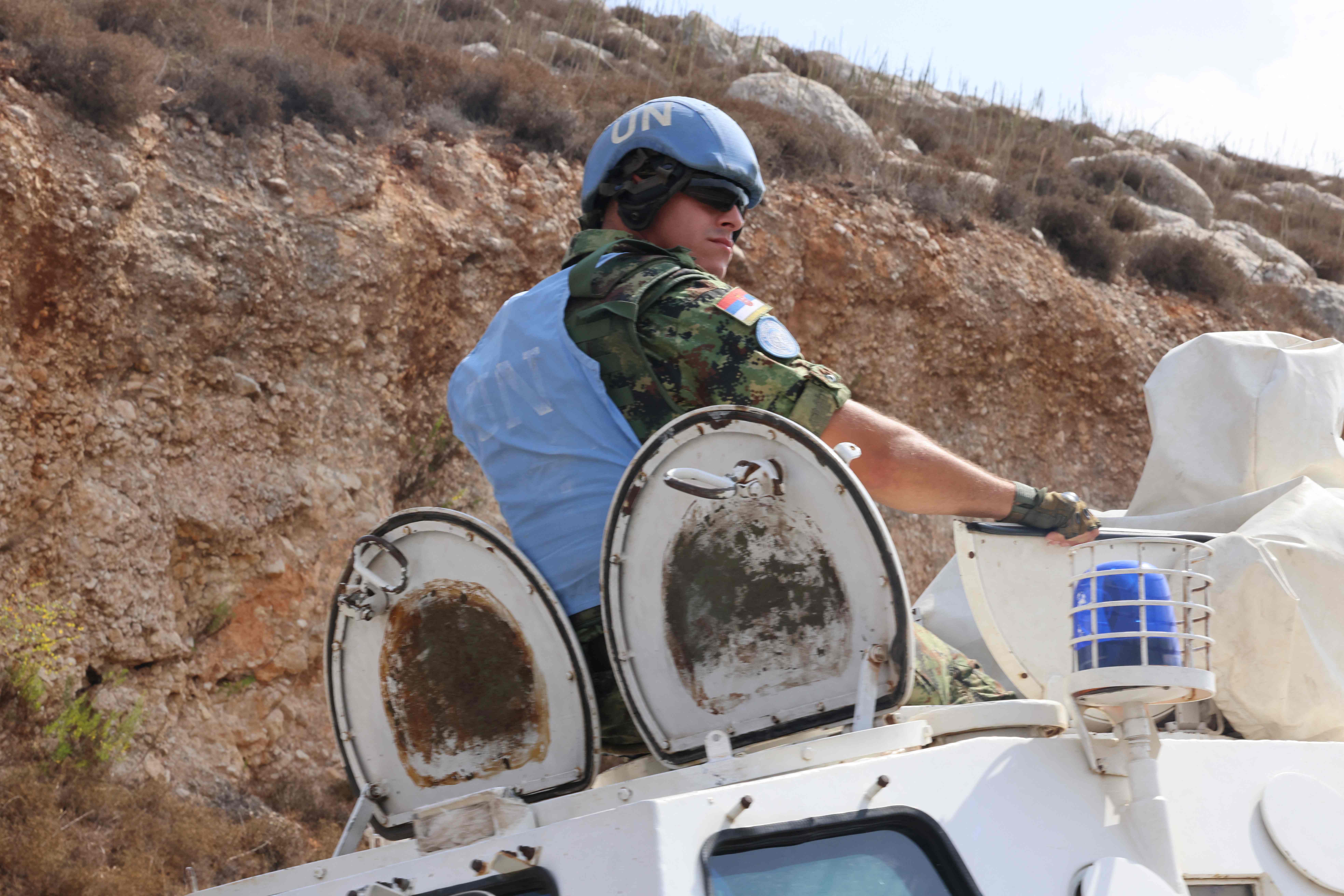 A United Nations Interim Forces in Lebanon (UNIFIL) patrol drives through the southern Lebanese plain of Khiam along the border with Israel on October, 10 2023