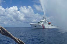 Chinese coast guard claims to have chased away Philippine navy ship from South China Sea shoal