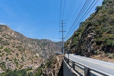 Man dies after car plunges off cliff in Malibu after colliding with two poles