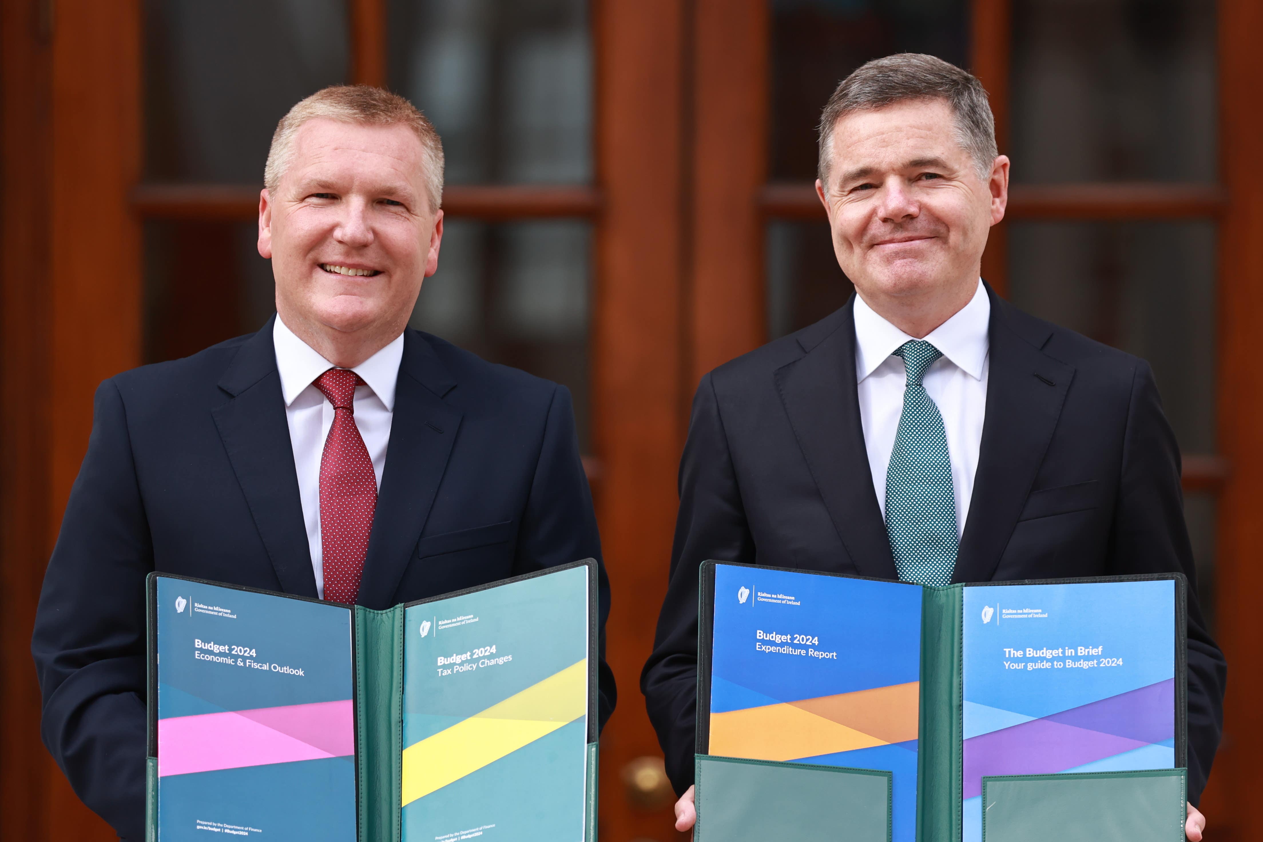 Minister for Finance Michael McGrath, left, and Minister for Public Expenditure Paschal Donohoe arrive at Leinster House in Dublin, to unveil the Government’s Budget (Liam McBurney/PA)