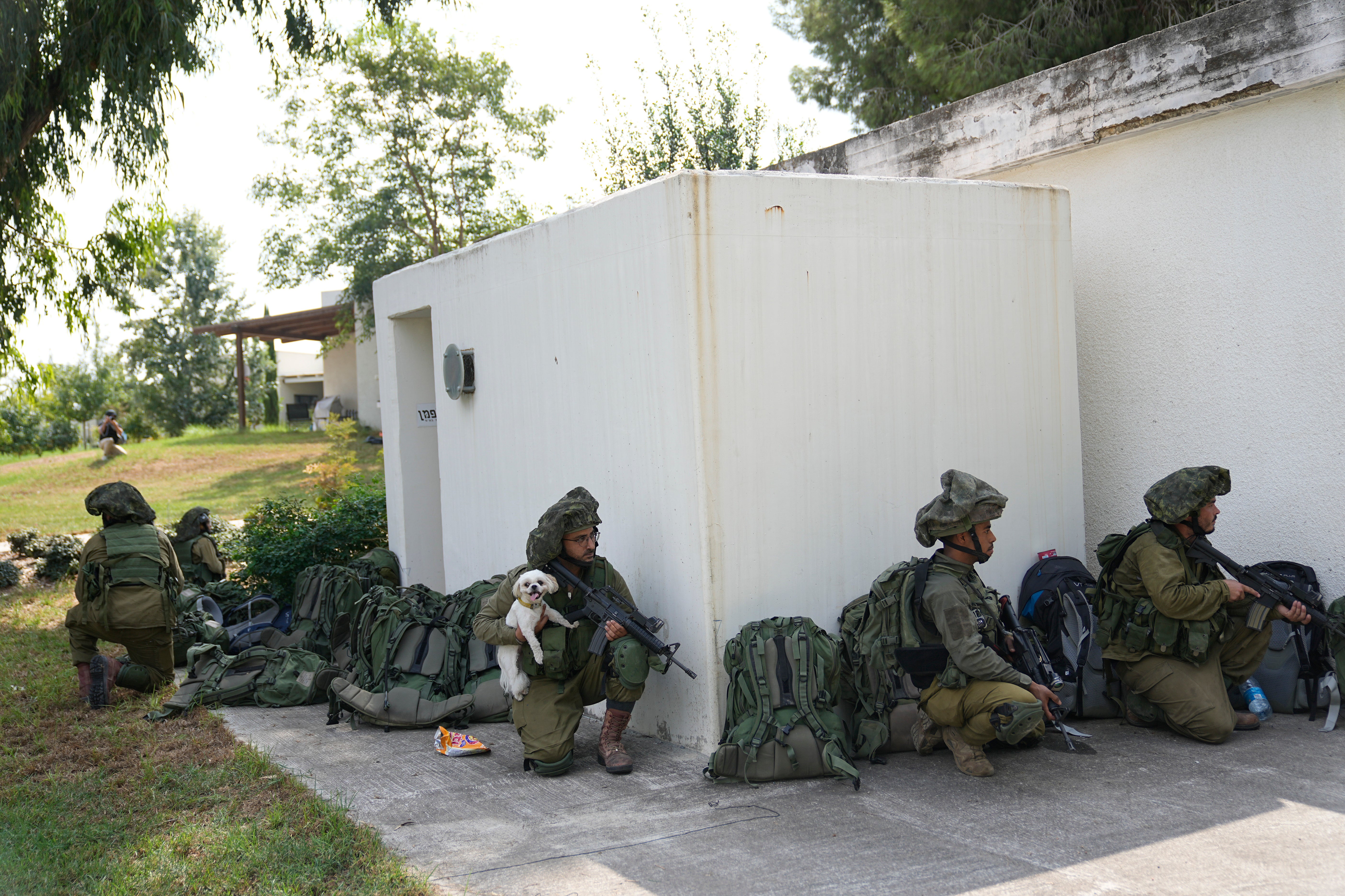 Israeli soldiers in the village of Kfar Aza near the border with Gaza